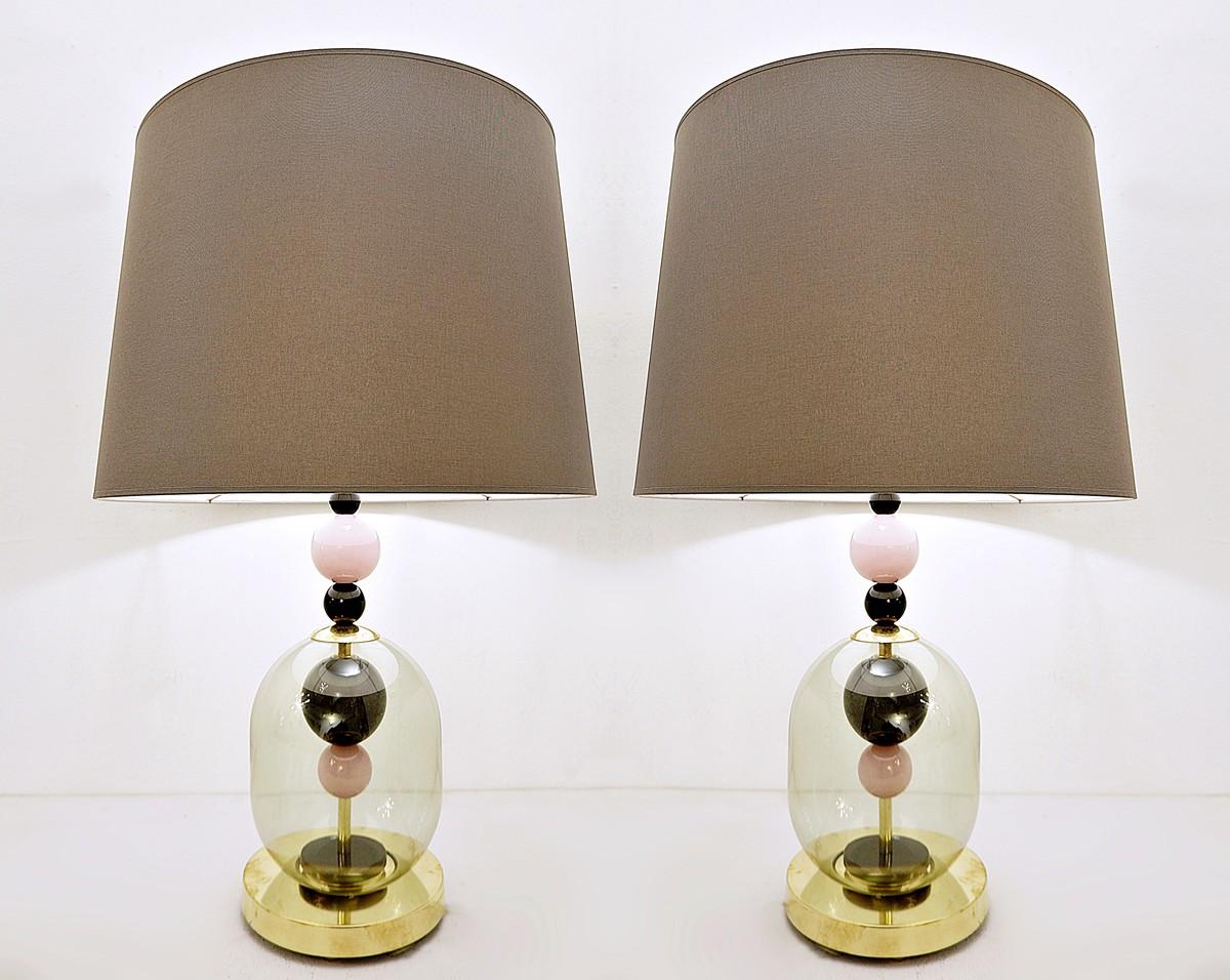 Pair of Italian table lamps in transparent smoked pink and black glass.