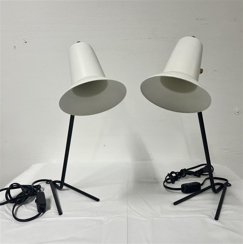 A pair of beautiful Italian Table Lamps by G.C.M.E with enameled black painted base and white cones with brass details. 
New old inventory

Wired for U.S. use.

Cone Dimensions:
Depth - 5.5