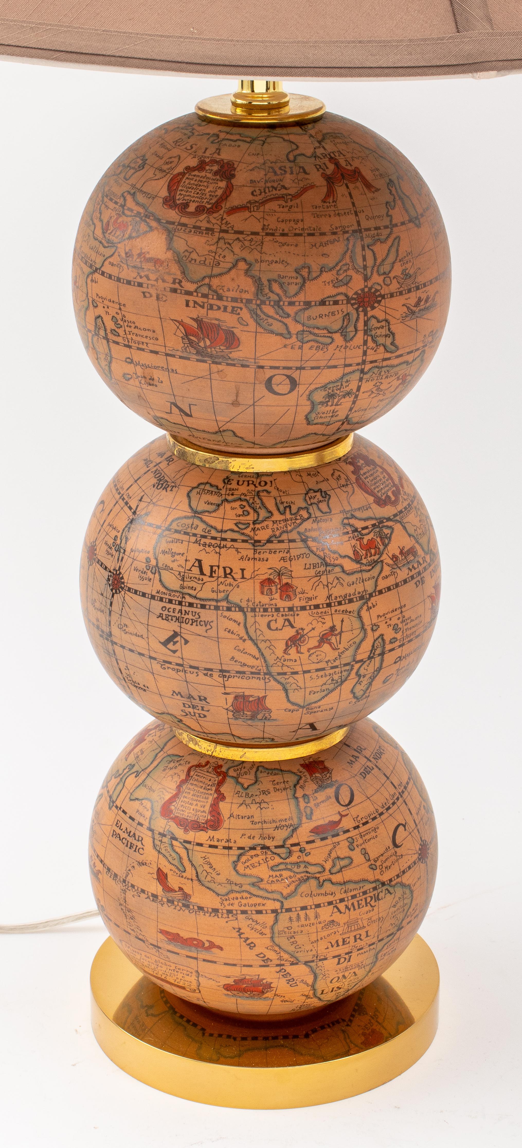 Pair of Italian terracotta lamps covered with paper globe transfers. Made in the 1950's. Recently rewired with high quality parts and cast brass bases.