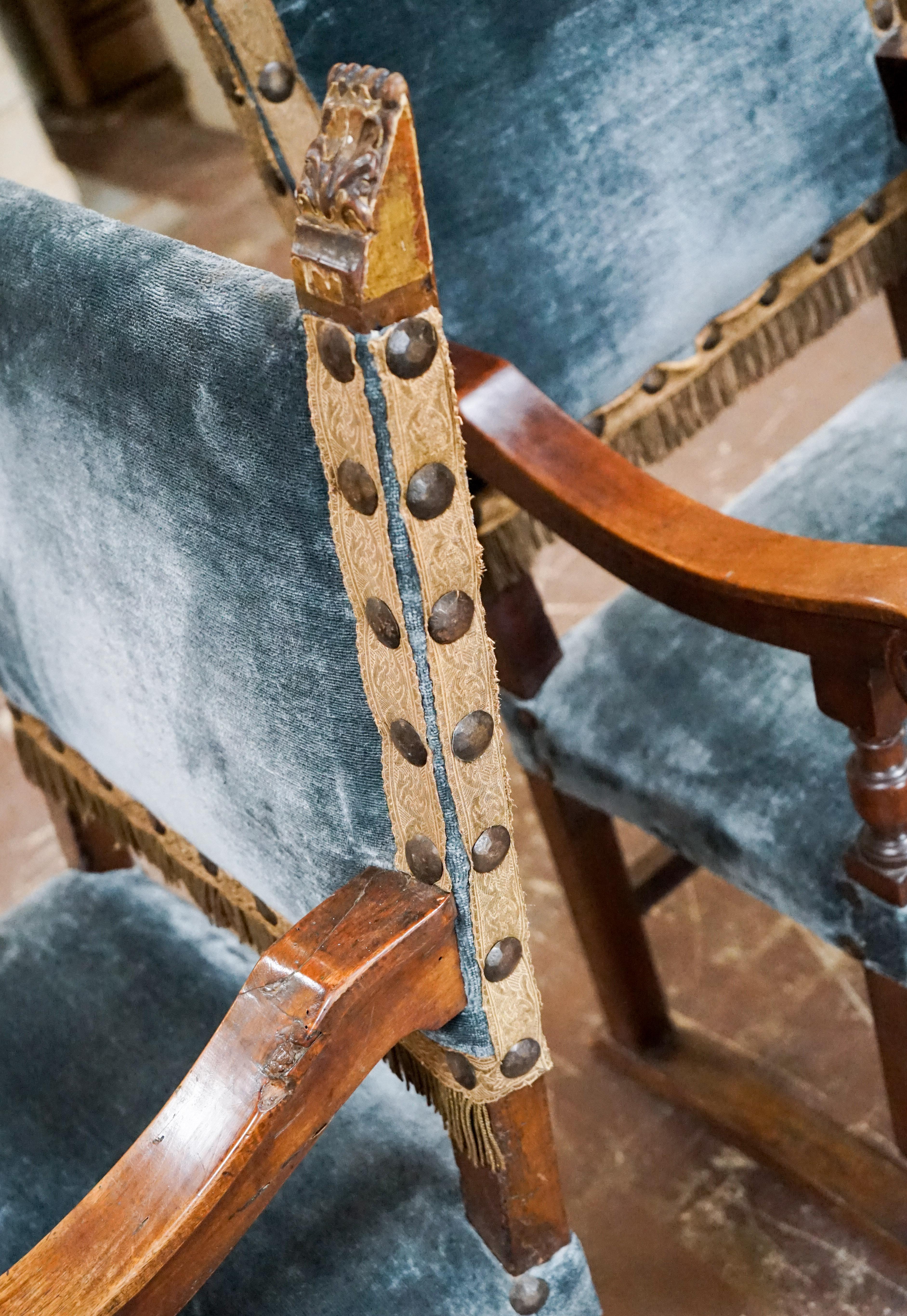 Lustrous blue mohair upholstery accents sturdy walnut bases on these 18th century palace throne chairs from Italy. 

Measurements: 

23'' D x 22.75'' W x 47'' H.
