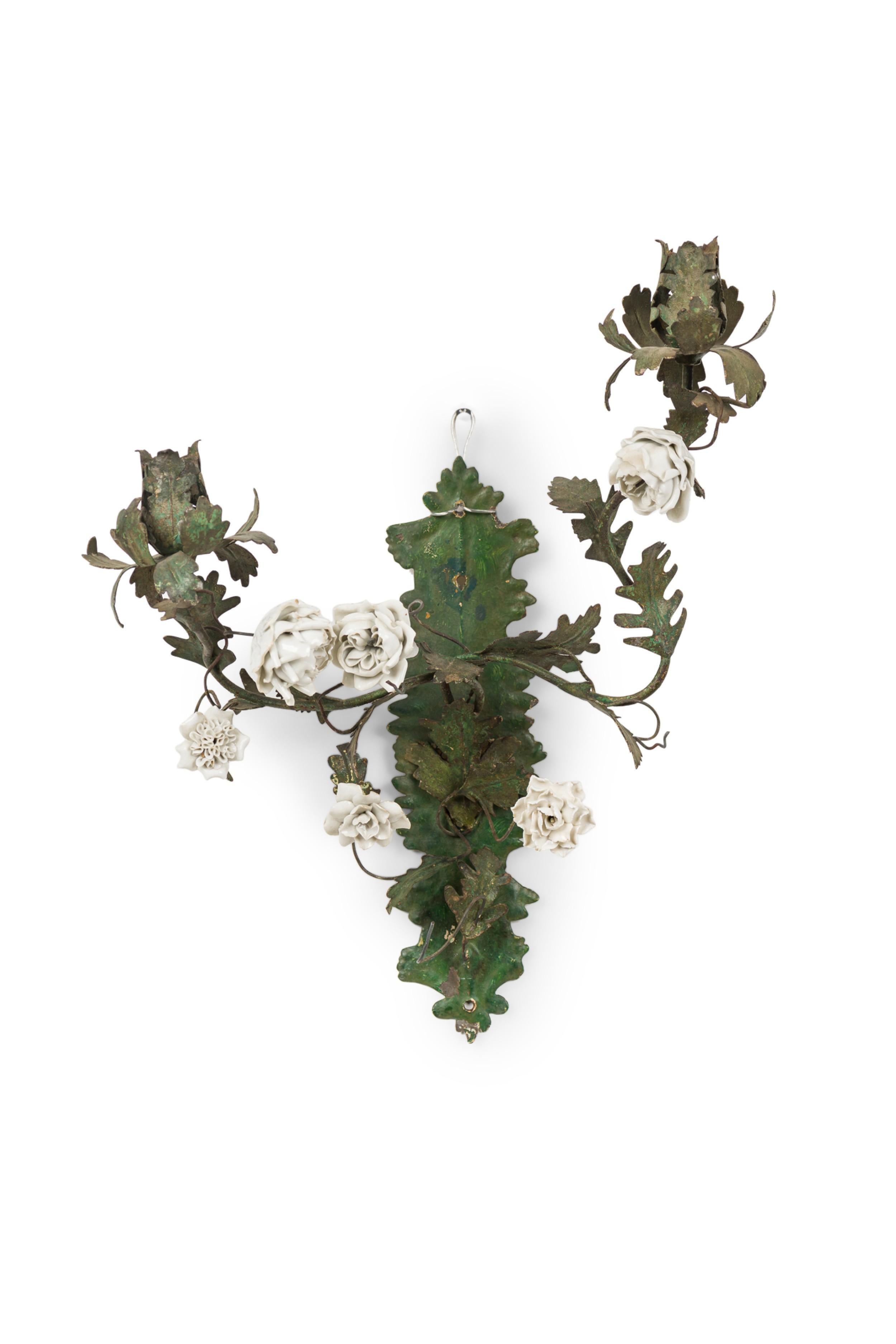 PAIR of Italian (19th Century) two-light floral wall appliqués / sconces featuring green enameled leaves and mount with attached off-white porcelain rosettes. (PRICED AS PAIR)
 

 Wear to finish.
