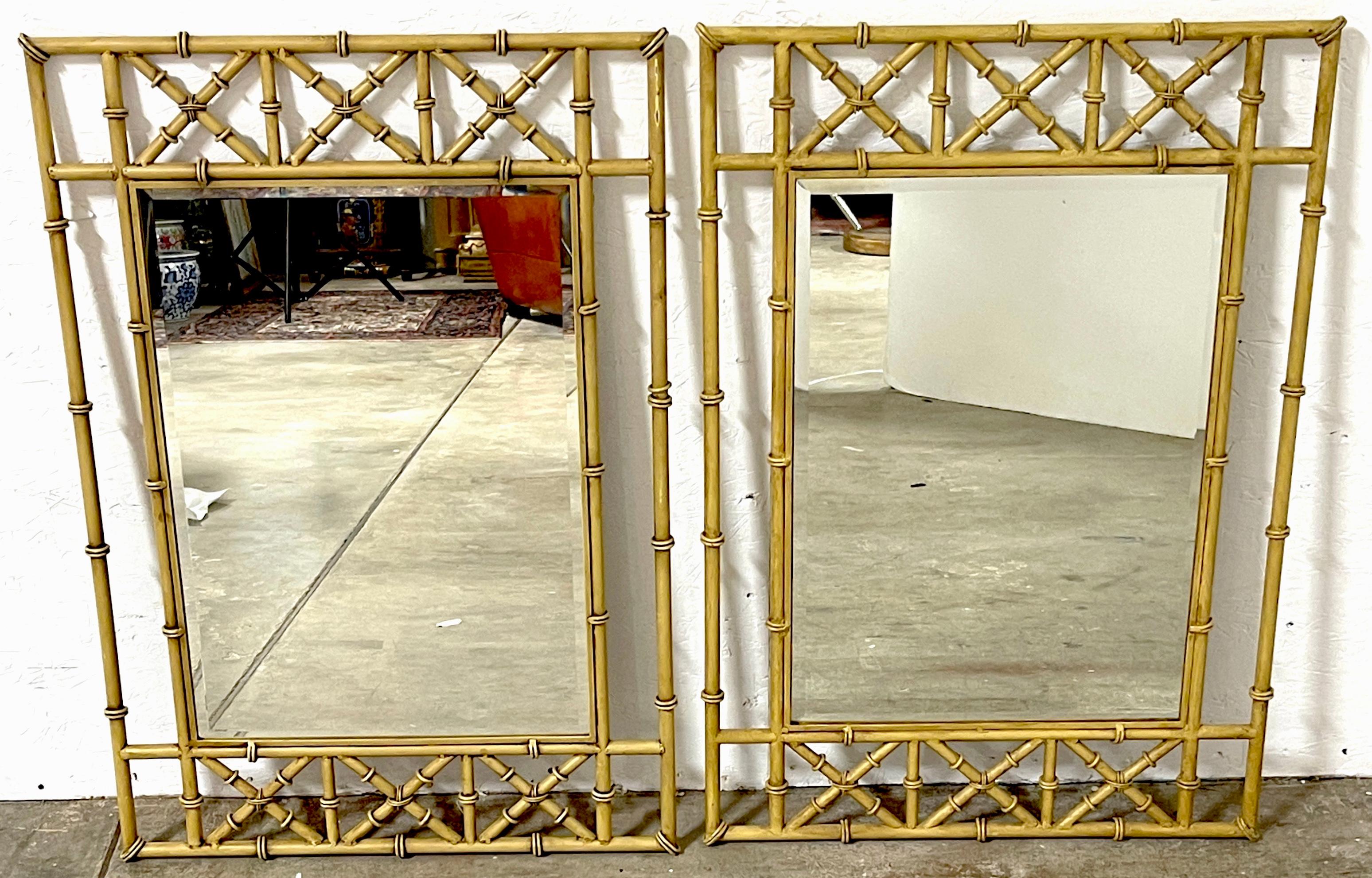 Pair of Italian Tole Faux Bamboo Mirrors 
Italy, Circa 1960s
A good pair of Italian Tole Faux Bamboo Mirrors dating back to the 1960s. Standing at 33 inches in height and 23 inches in width, each mirror boasts an elegant 'X' design trellis pattern,