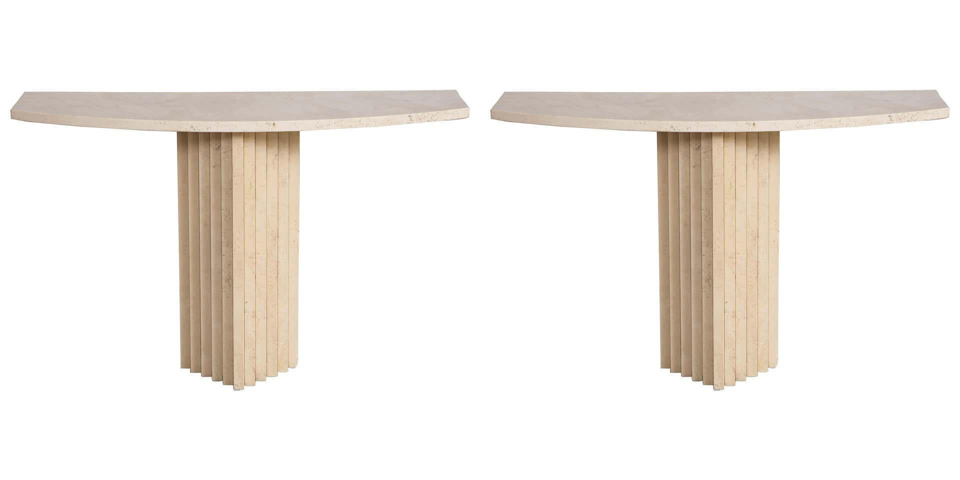 Pair of Italian 1970's travertine console tables with carved stepped pedestal supporting the shaped top.
Rome, Italy, late 1970's
Size: 29 3/4