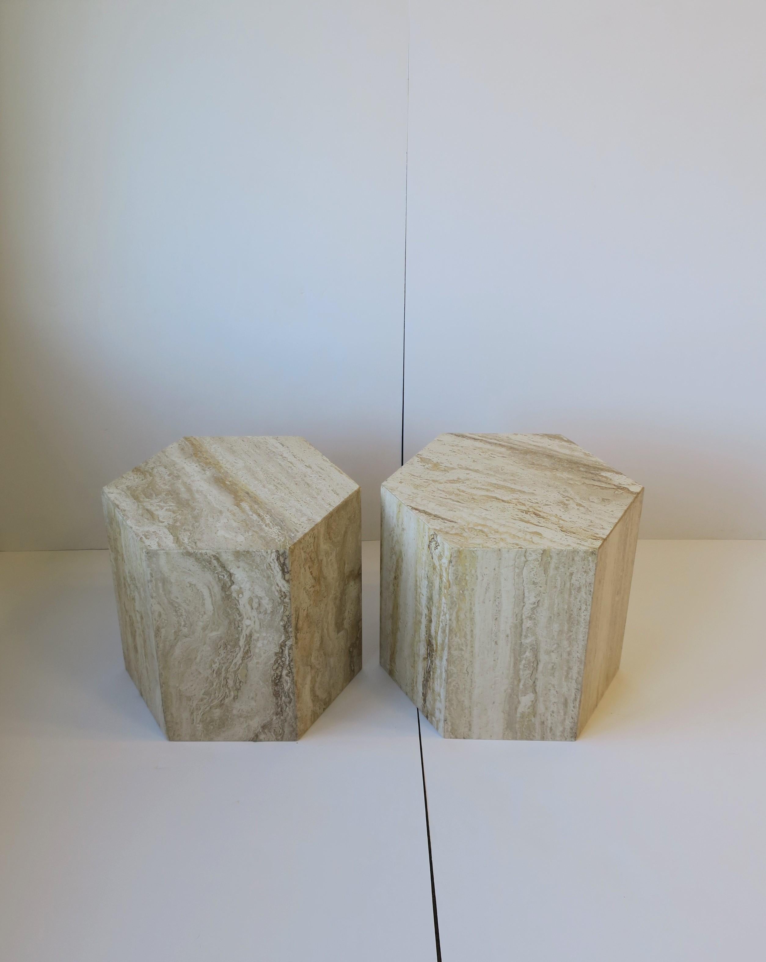 A very beautiful, chic and substantial pair of Italian travertine marble side tables; '70 Modern or Postmodern period, circa late 20th century, Italy. This set/pair of travertine marble tables are a 'hexagon' shape with colors comprised of