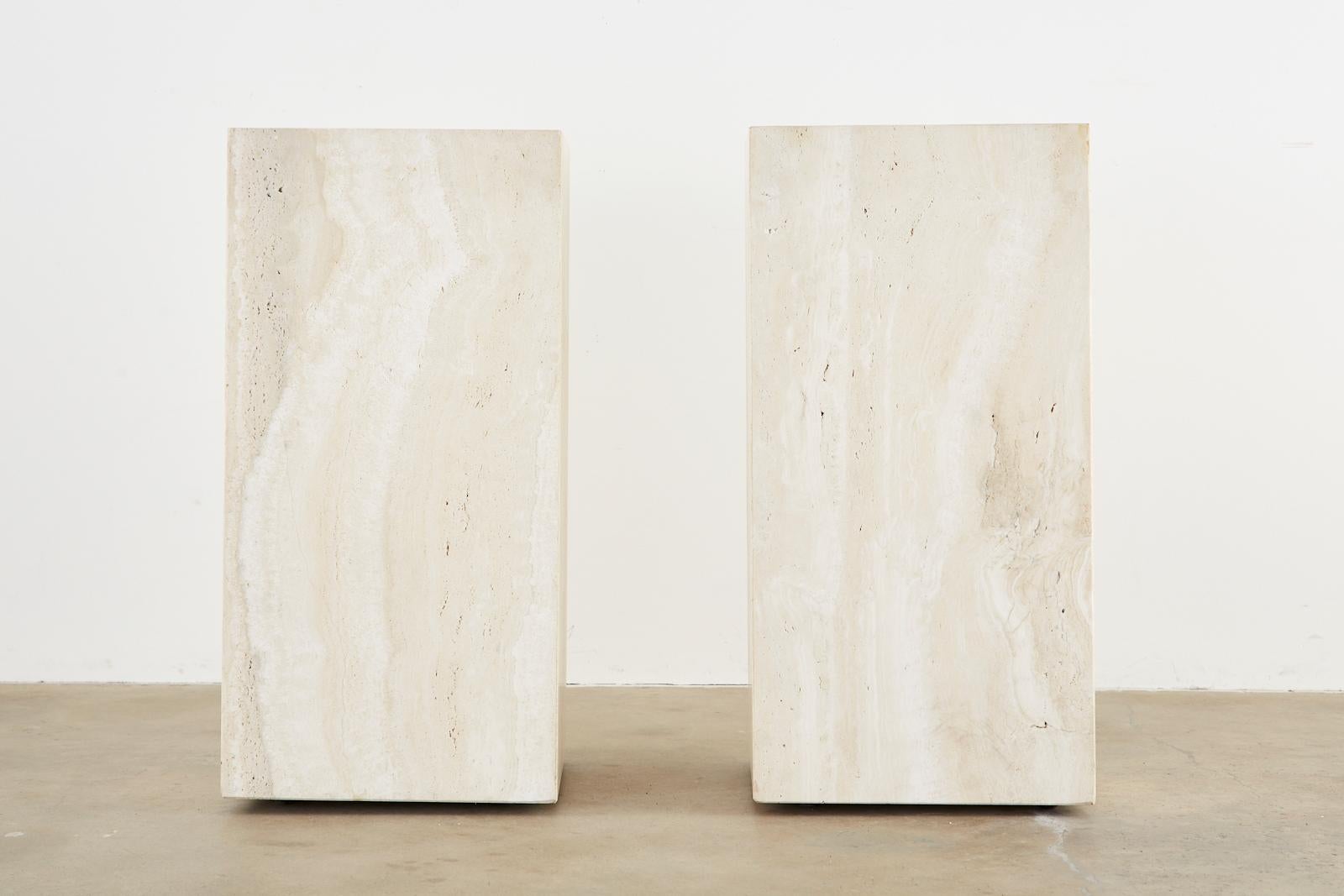Modern pair of matching Italian pedestal display tables or presentation pedestals made from thick nearly 1 inch slabs of travertine. Featuring an inset frosted glass top with a mount for a light source underneath. Excellent joinery and craftsmanship