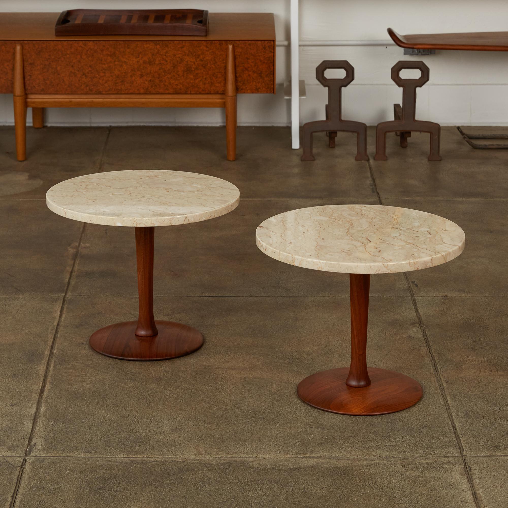 Pair of Italian marble side table with turned walnut base. This pedestal end tables feature polished circular cream travertine tops with turned walnut stem and rounded flat bases. Stone is marked “Italy” on the underside. 

Dimensions: 18” diameter