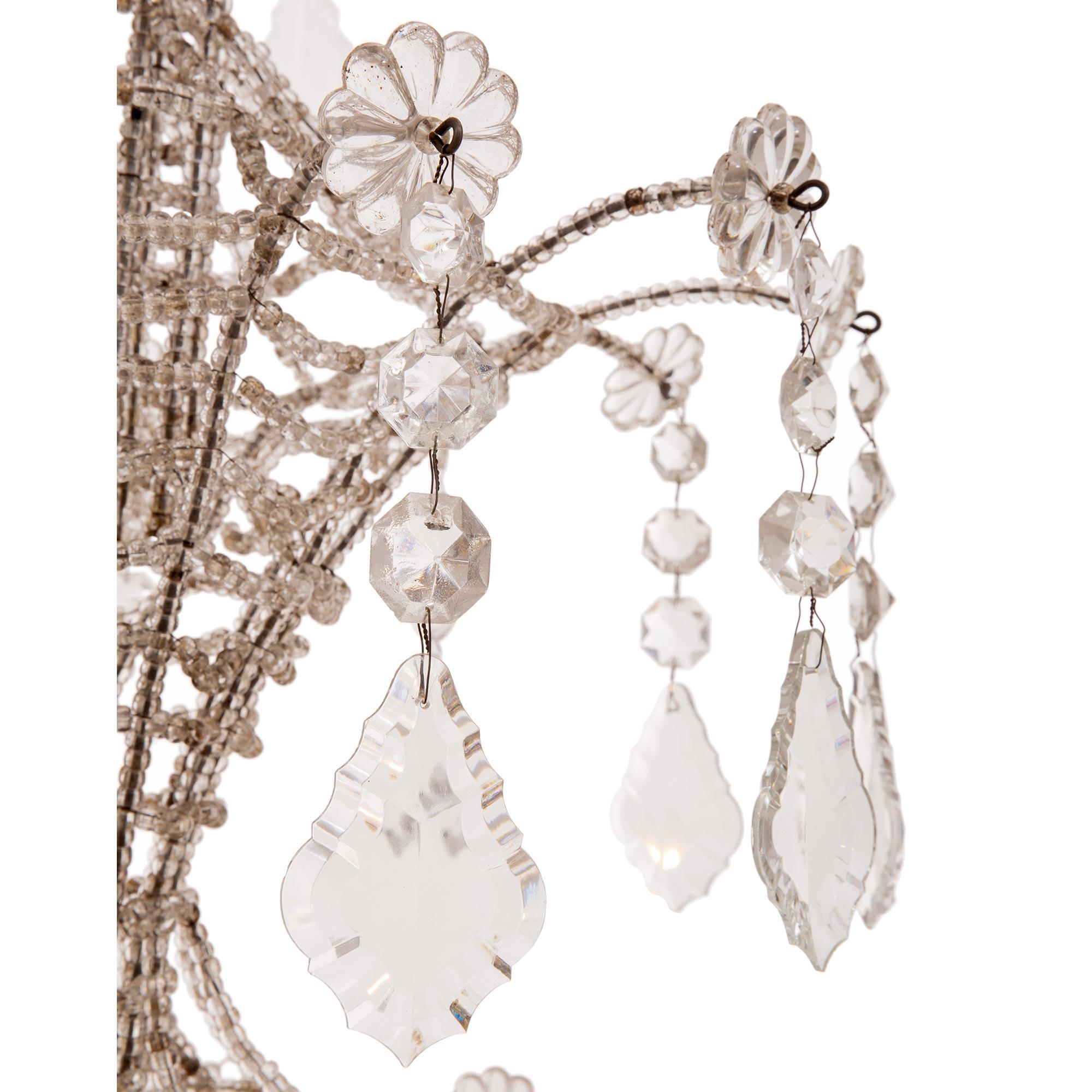 Cristal Paire de lustres de style vénitien du début du siècle en fer et cristal en vente