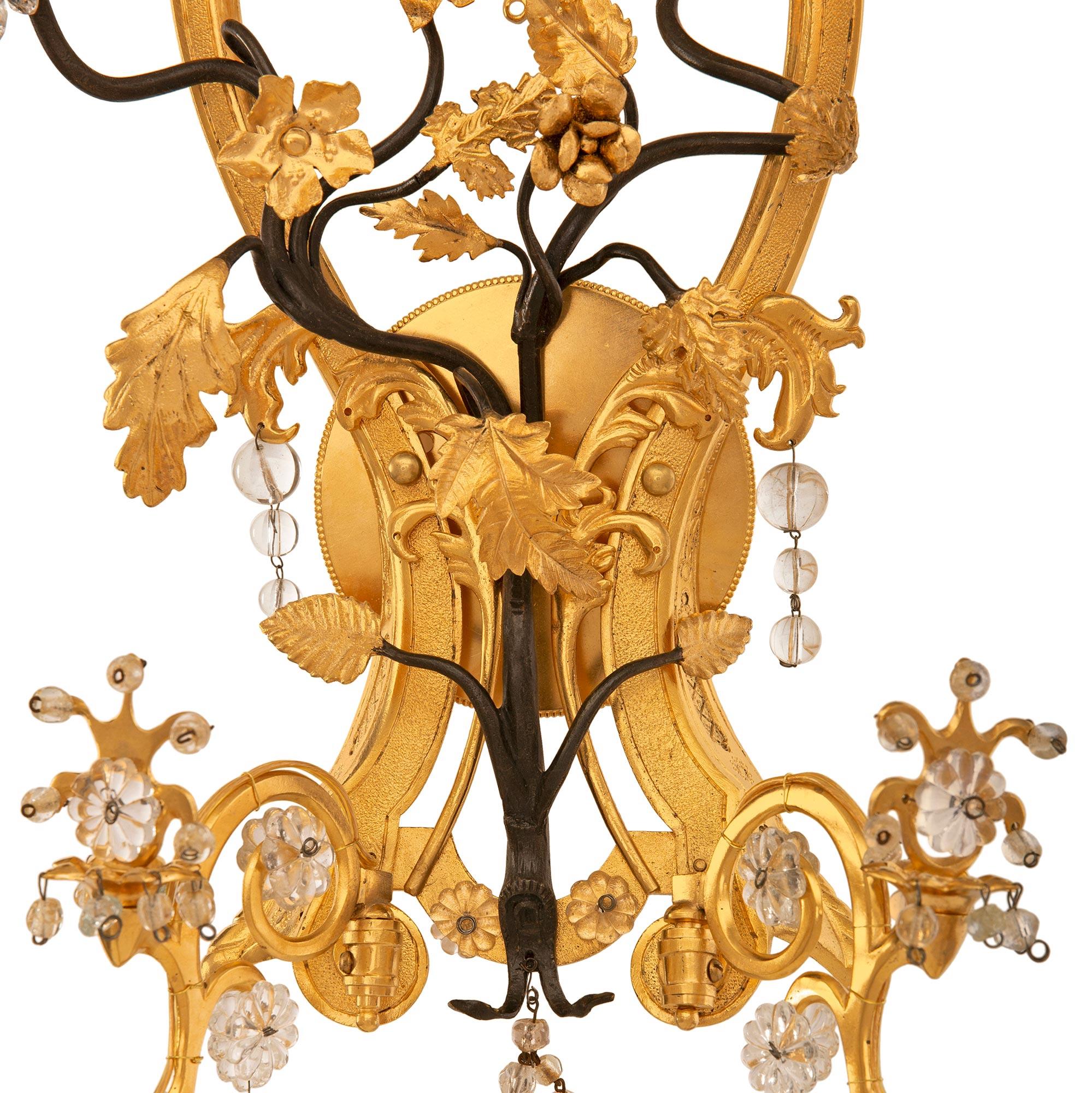 Pair of Italian Turn of the Century Louis XVI St. Ormolu and Crystal Sconces In Good Condition For Sale In West Palm Beach, FL