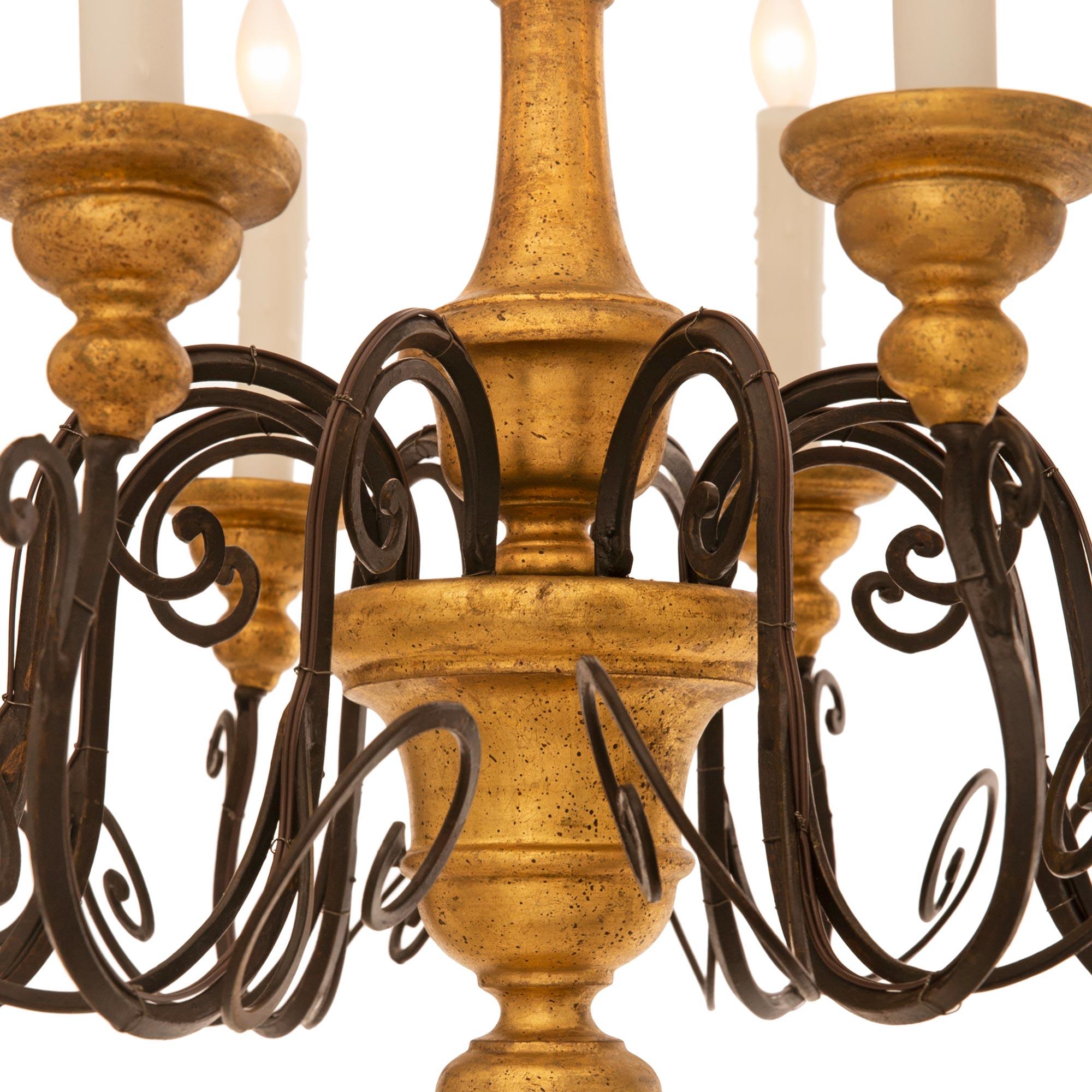 20th Century Pair Of Italian Turn Of The Century Wrought Iron And Giltwood Chandeliers For Sale