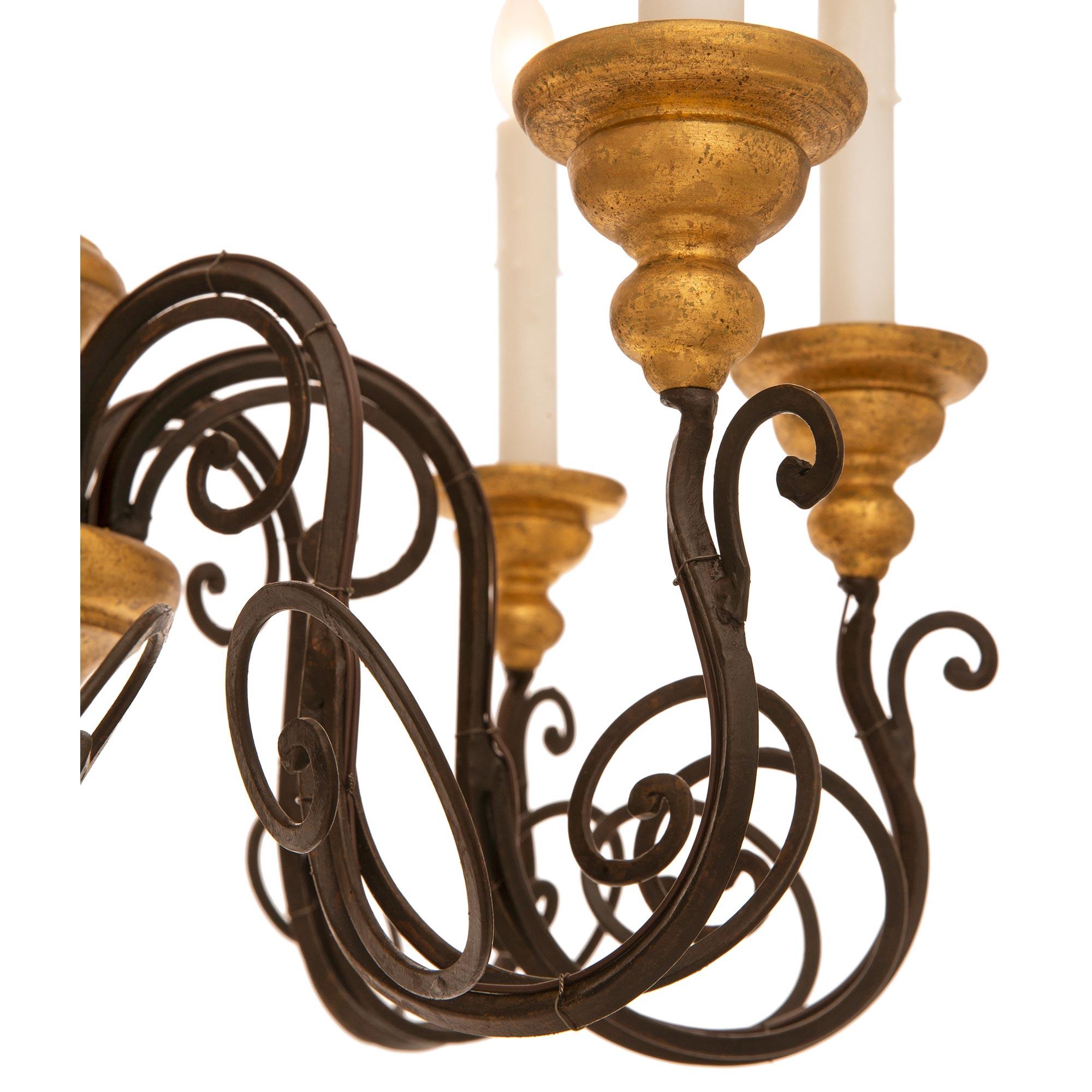 Pair Of Italian Turn Of The Century Wrought Iron And Giltwood Chandeliers For Sale 1