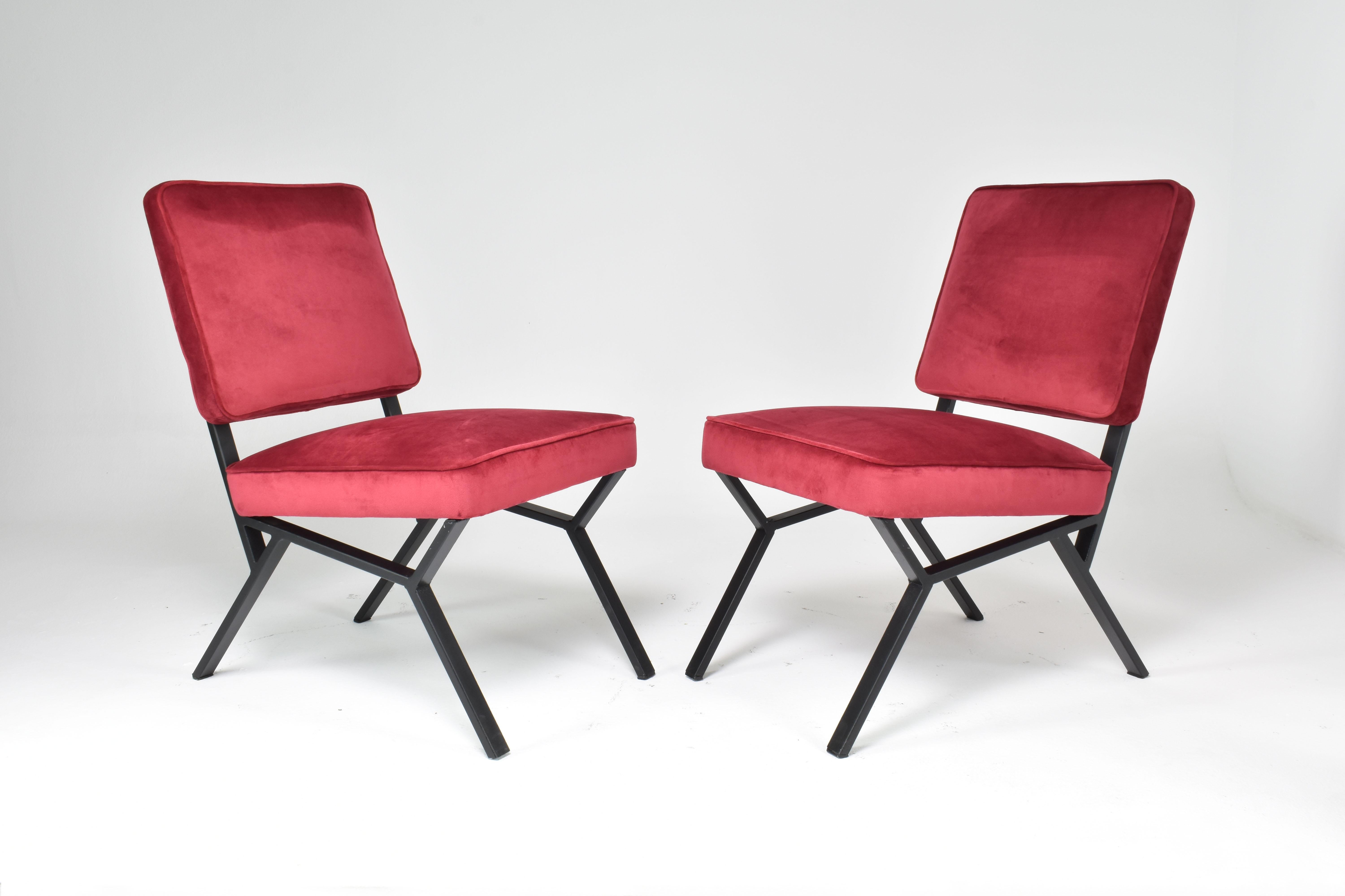 A pair of mid-century modern Italian chairs designed by Giancarlo Bovini and composed of metal and fully restored at our atelier in a bright new red upholstery. 
The design is well-proportioned for optimal comfort and durability. 
Styling red
