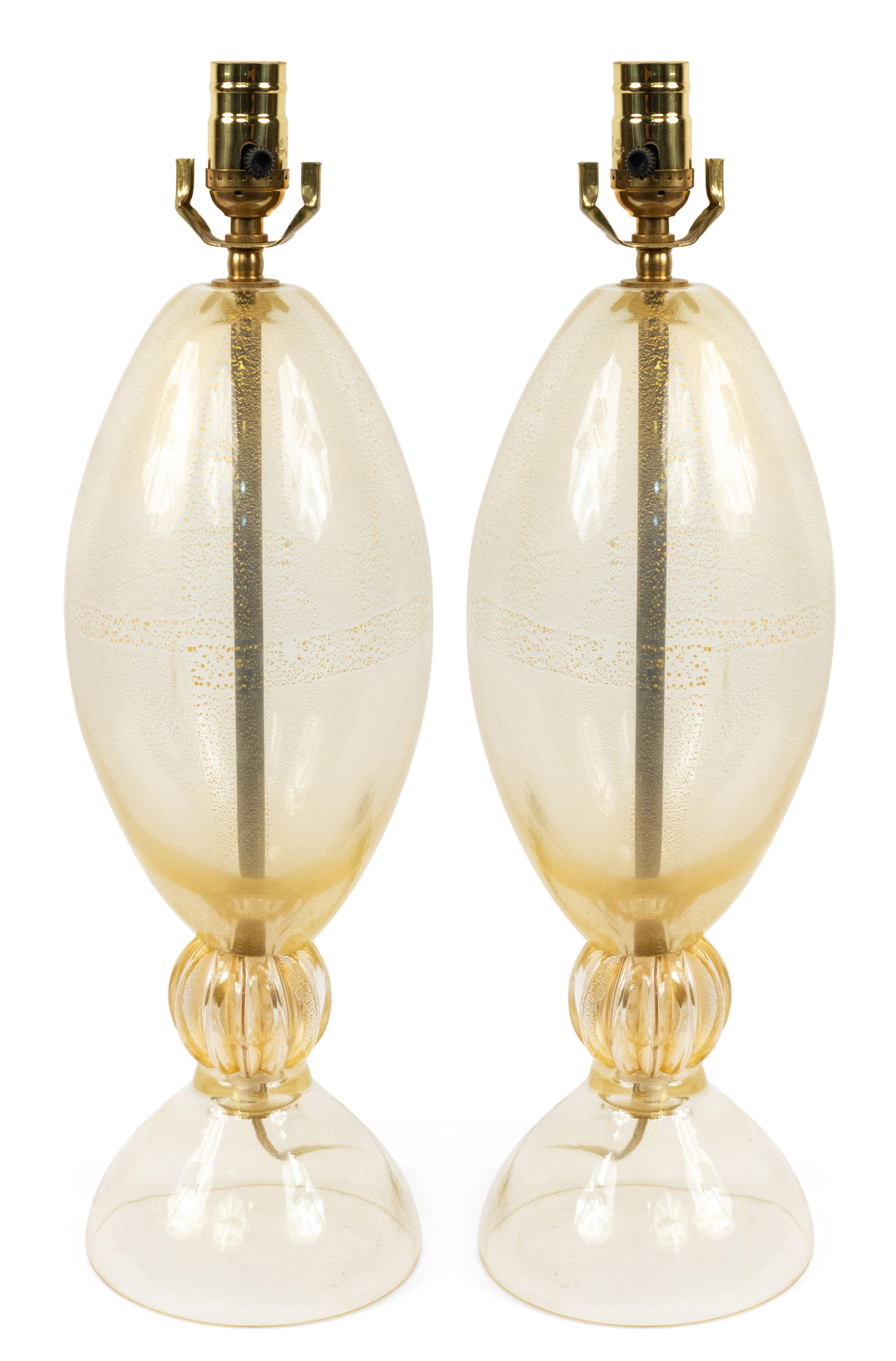 Pair of Italian Venetian 1940s gold dust Murano glass lamps with a shaped form separated by a fluted section.

 