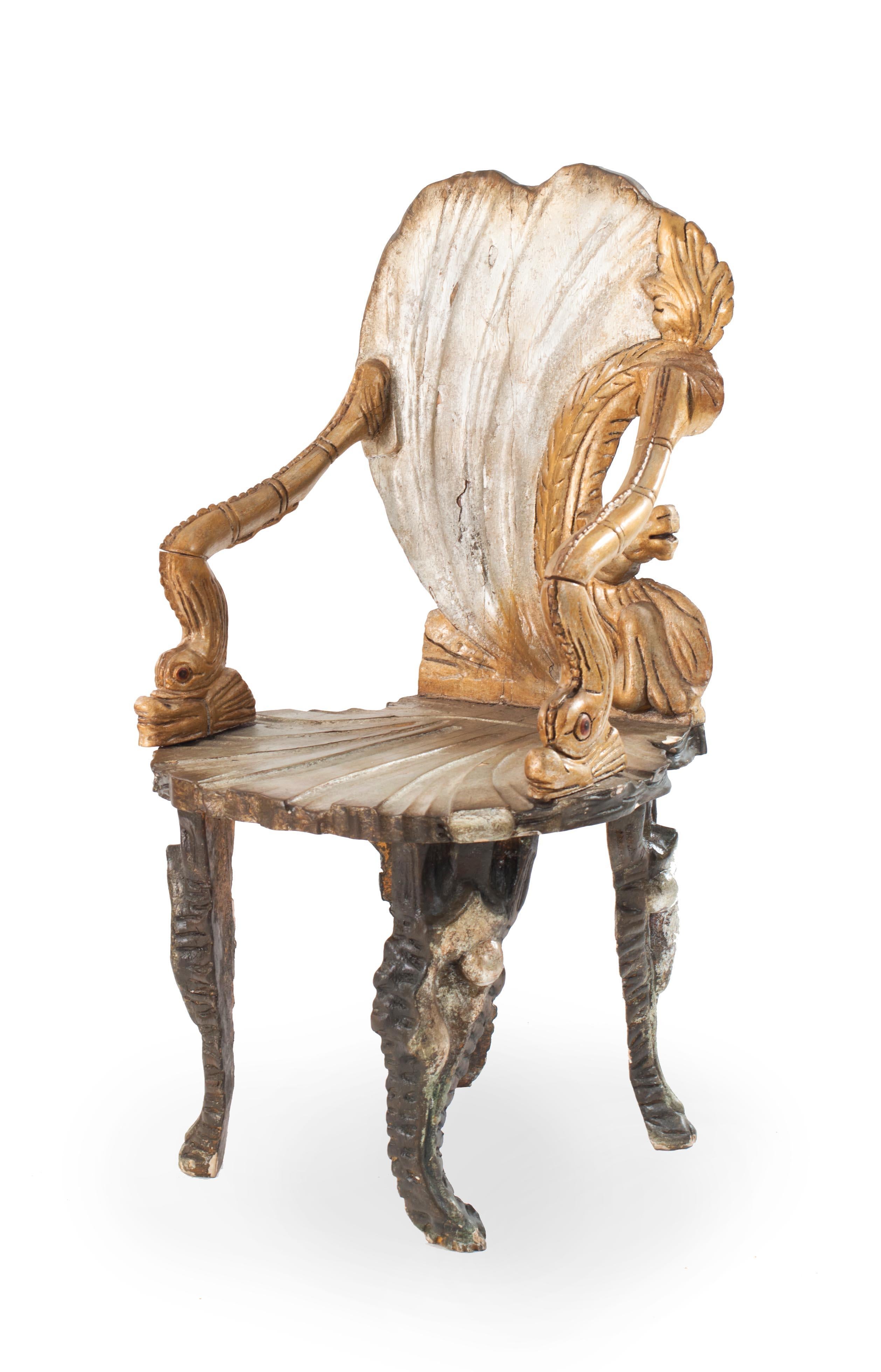Pair of Italian Venetian Grotto style armchairs with a silver gilt finish and carved shell and seahorse detail having left and right facing backs.
