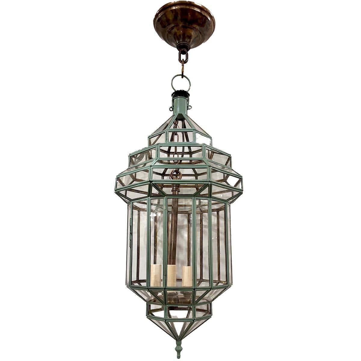 Pair of circa 1950's Italian verdigris painted metal lanterns with 3 lights. 
Sold individually.

Measurements:
Height of body: 22