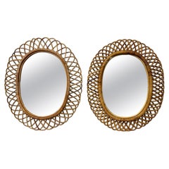 Coppia di specchi ovali in rattan italiani d'epoca