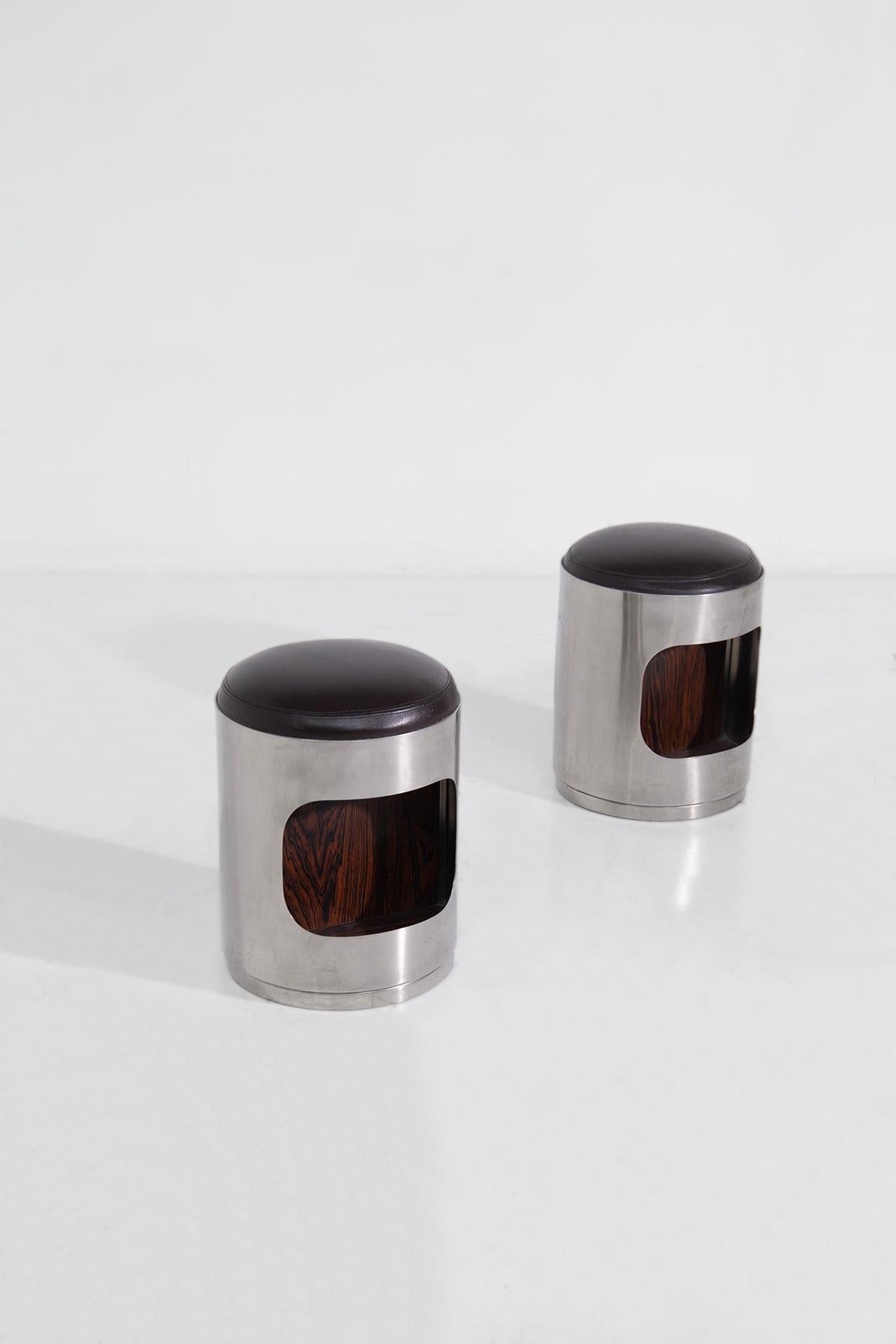Step into the realm of visionary design with this iconic pair of stools from the 1960s, attributed to the illustrious Vittorio Introini. This duo stands as a monument to the era's bold exploration of form and function, encapsulating the spirit of