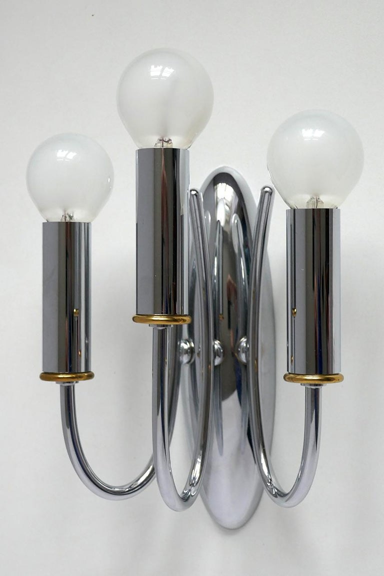 Beautiful pair of modernist chrome and brass wall sconces.
Italy, 1960s-1970s
Lamp sockets: 3.