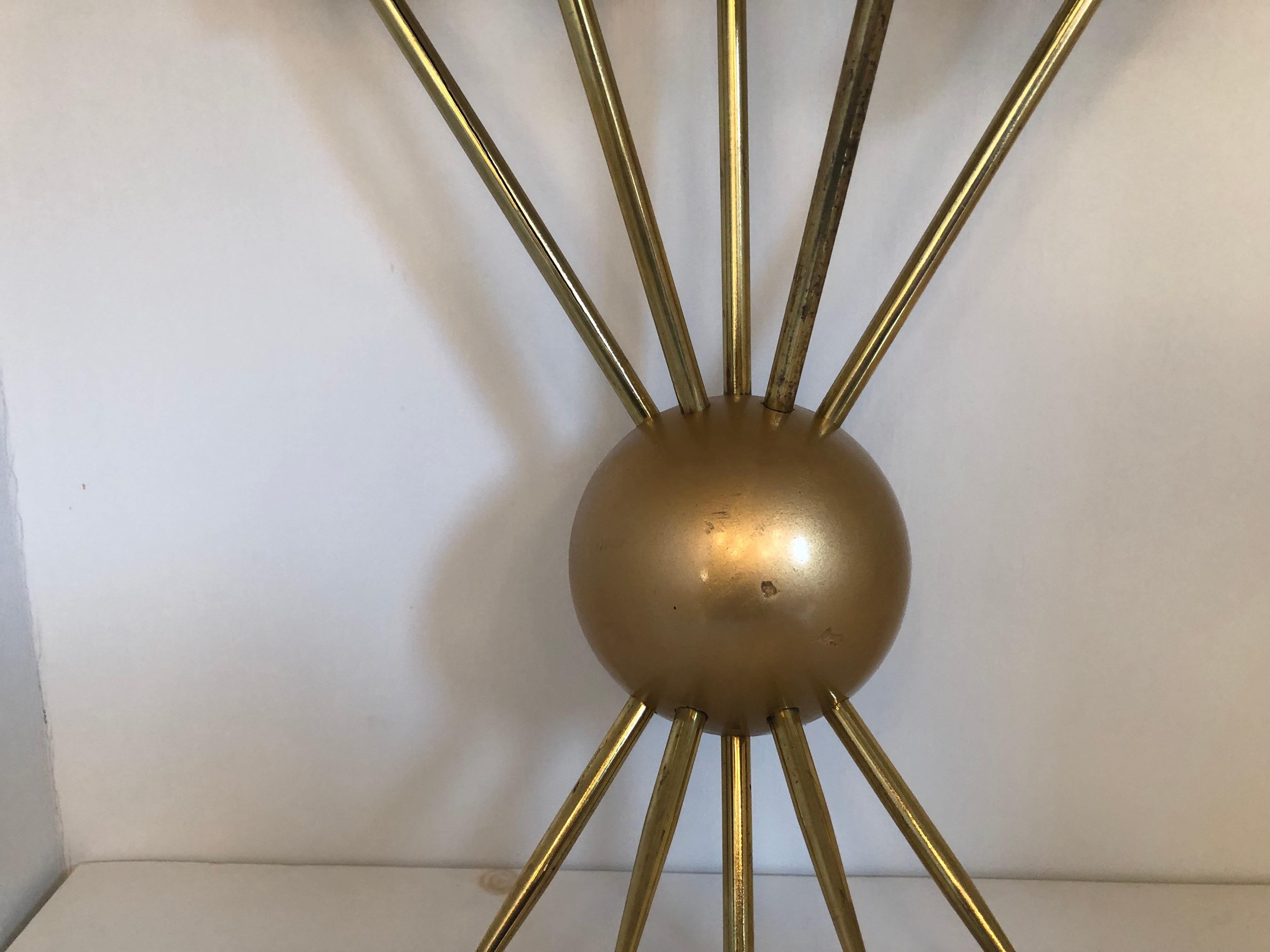 Pair of Italian wall light by Stilnovo
Ten polished brass light stems radiating from a matte brass semi-circular center with additional brass 