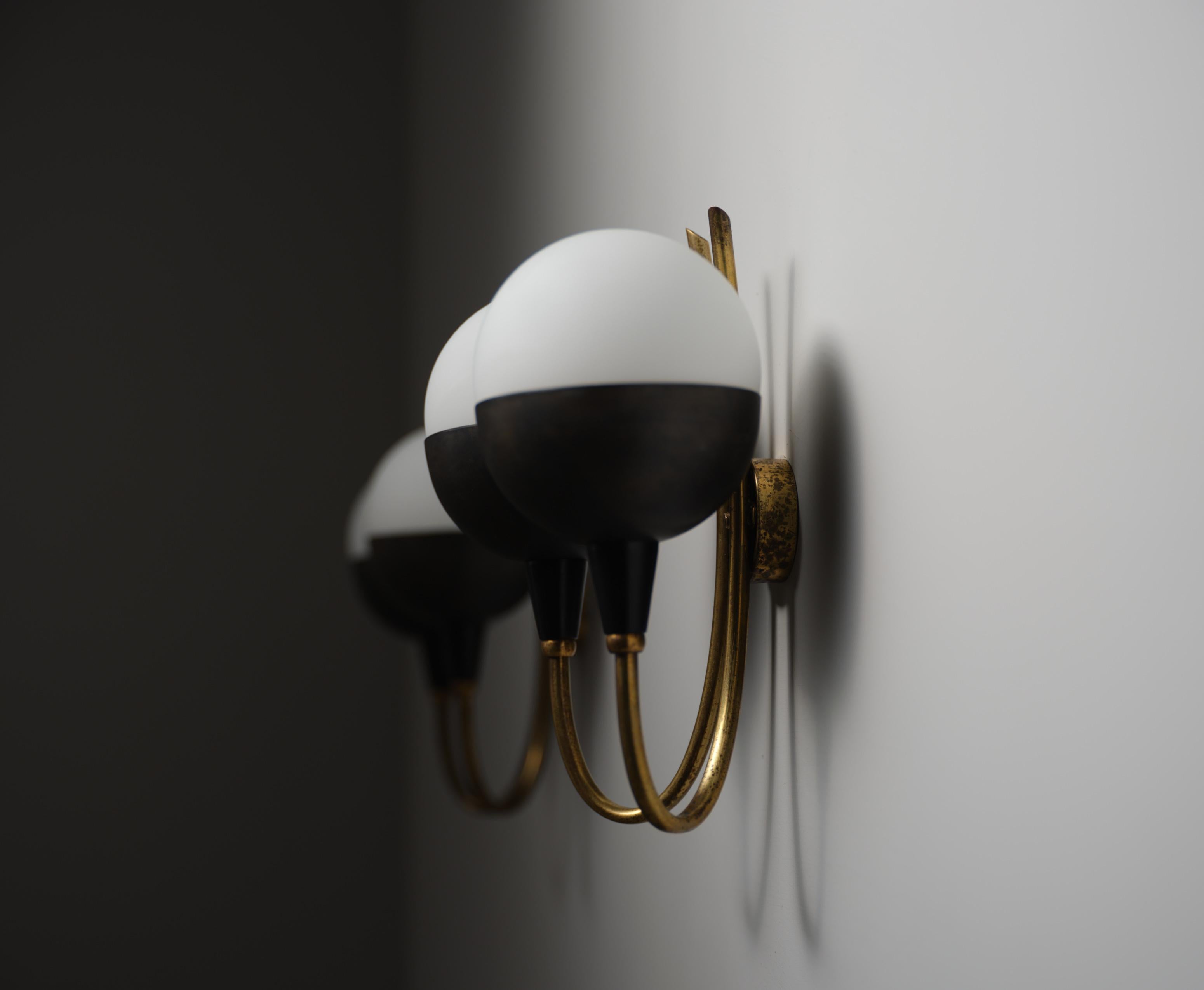 Mid-Century Modern Pair of Italian Wall Sconces in Brass, Burnished Iron and Opaline Glass, 1950s For Sale