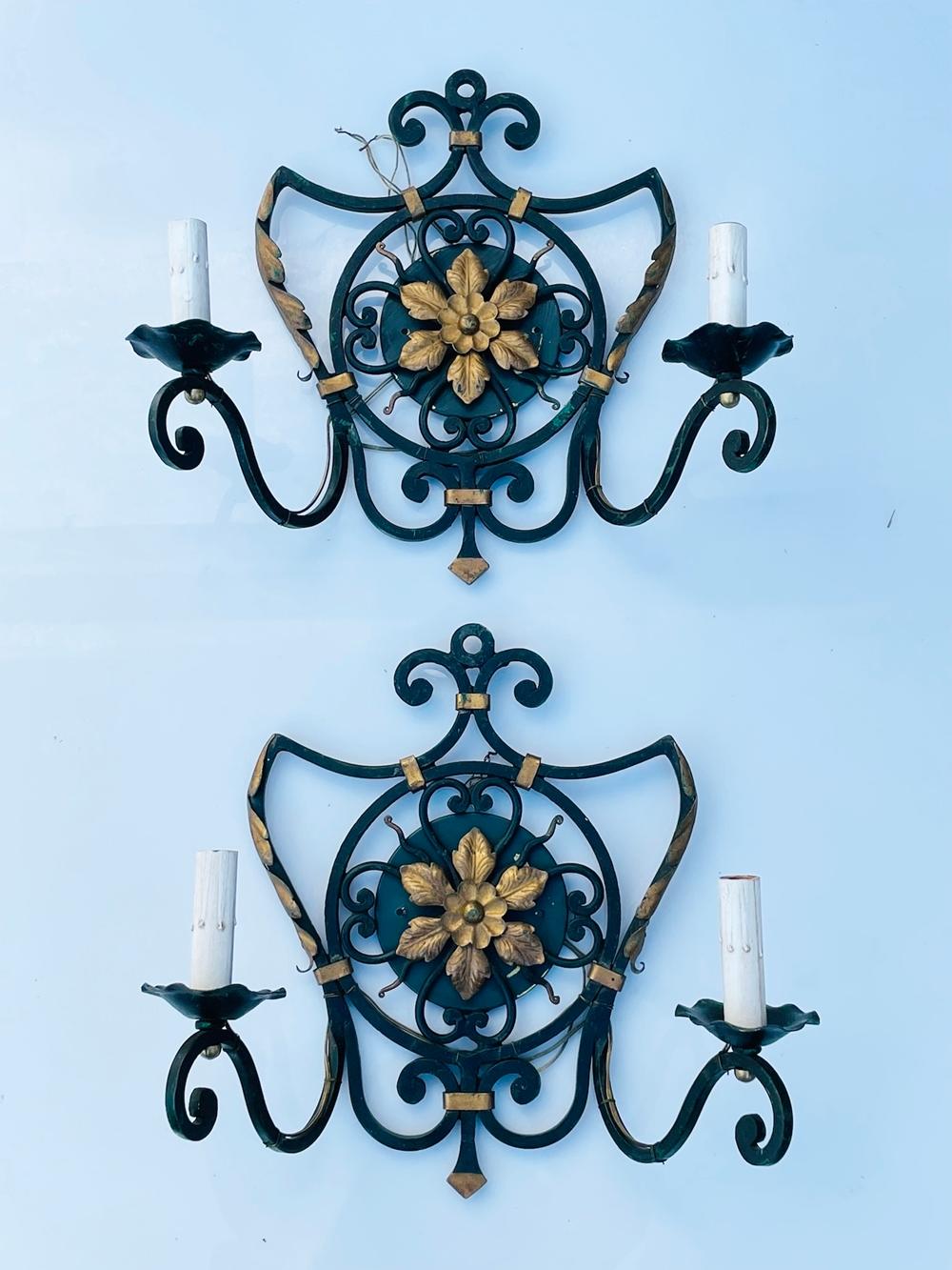 Introducing our stunning Pair of 1970's Italian Wall Sconces with Metal Gilt Accents, the perfect addition to any home looking for a touch of elegance and sophistication. Crafted from high-quality iron, these wall lights feature a sleek black finish