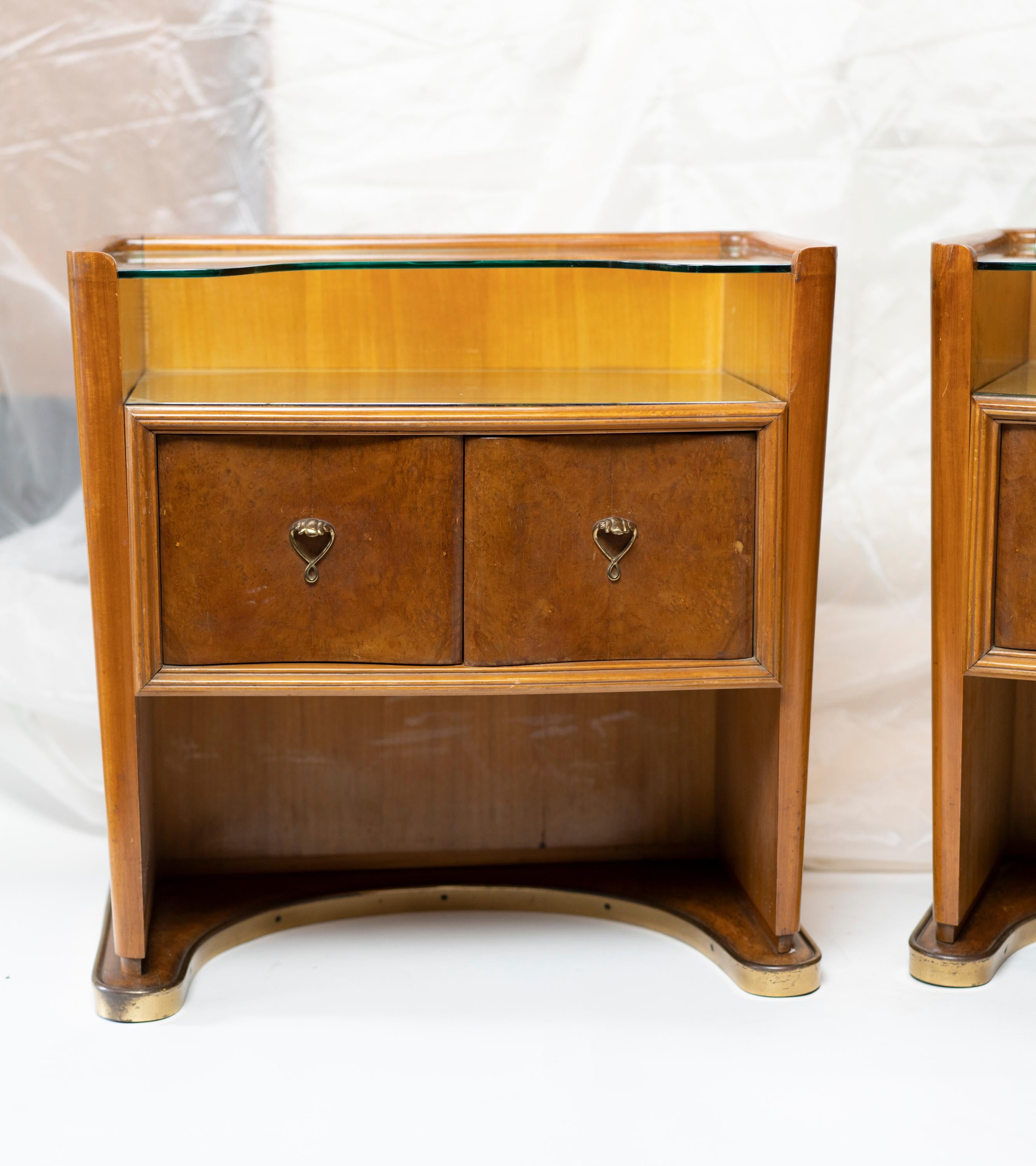 Pair of Italian walnut midcentury night tables by Vittorio Dassi with two-tier glass tops.