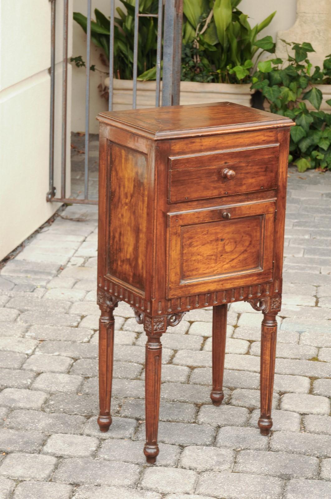 Neoclassical Pair of Italian Walnut Side Tables circa 1860 with Door, Drawer and Carved Skirt