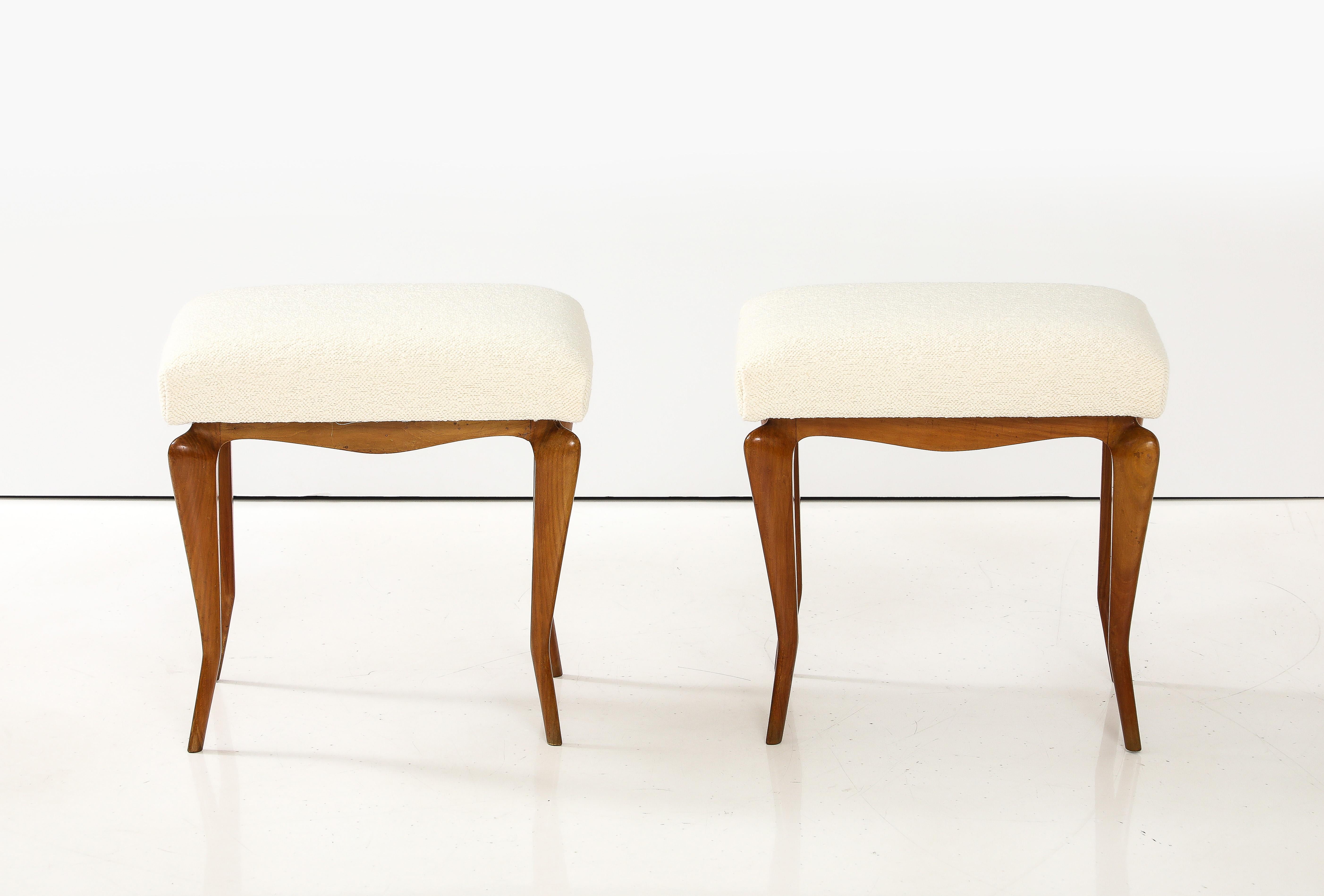A pair of fine and elegant Italian walnut stools with cabriole legs and shaped apron.  The seats newly upholstered in a European textured cream colored cotton. 
Italy, circa 1930 
Size: 19 1/2