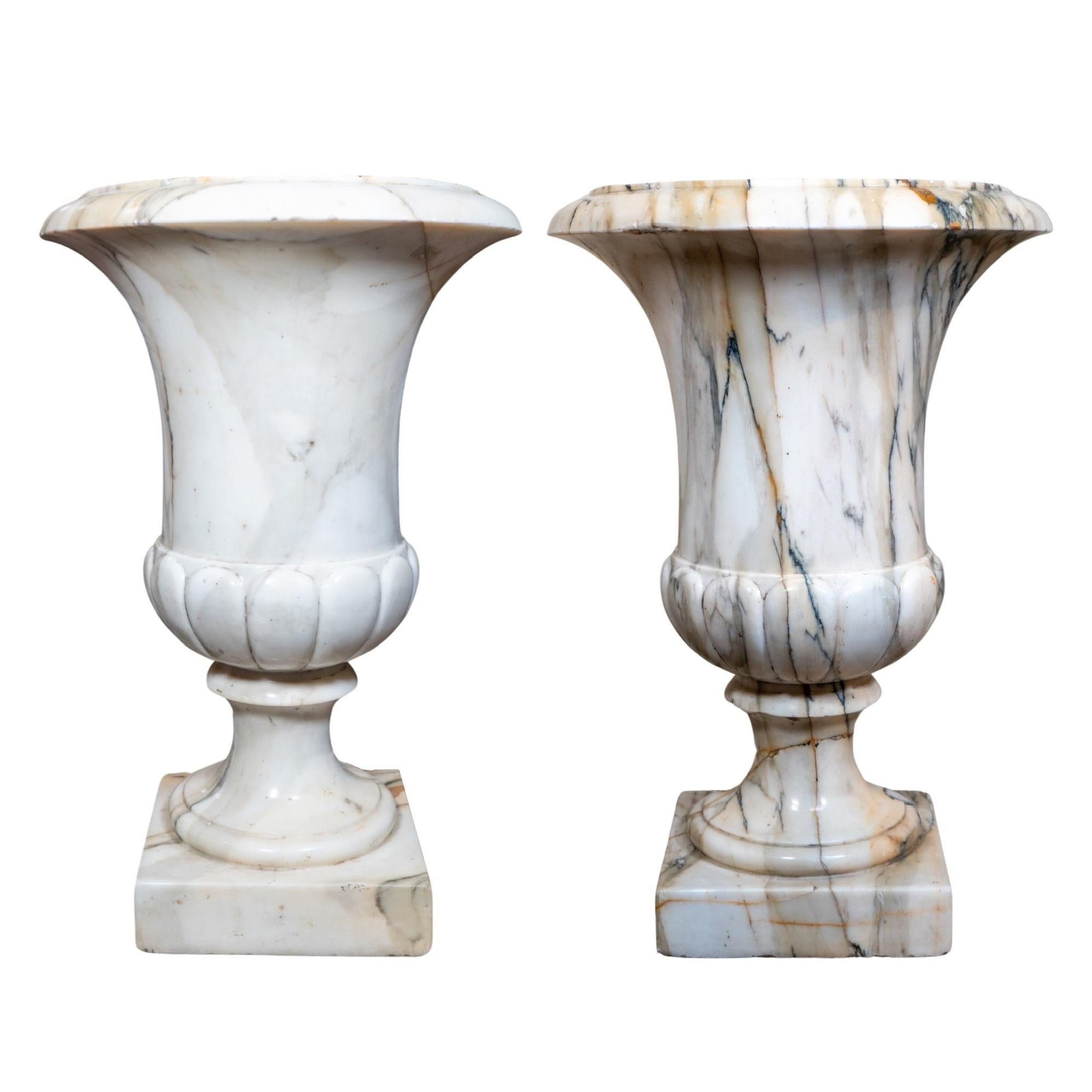 Enhance your indoor or outdoor space with this pair of Italian White Breche Marble Planters. Handcrafted in the 1870s from Italy, these planters provide a touch of elegance and sophistication to any setting. Made from high-quality white Breche