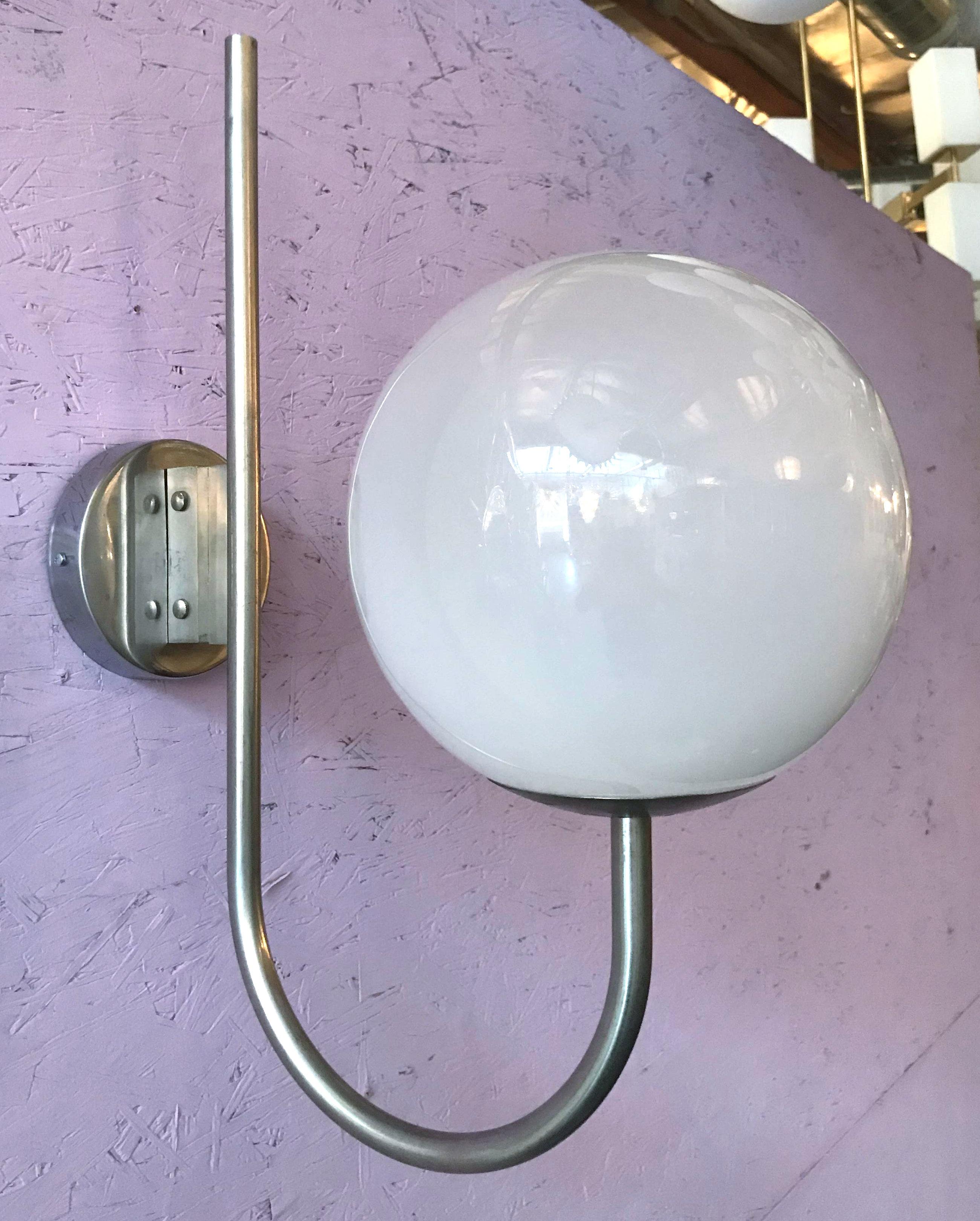 Vintage Italian wall lights with glossy white Murano glass globes mounted on nickel metal frames / Designed by Sergio Mazza, circa 1960s / Made in Italy
1 light / E26 or E27 type / max 60W
Height: 22.5 inches / Width: 8.5 inches / Depth: 17 inches
1