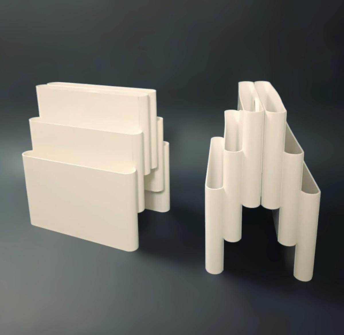 Vintage Italian mid-century white plastic magazine racks with six compartments and a round handle, designed by Giotto Stopinno for Kartell, model 4675 / Made in Milan Italy 1970s
Measures: height 18 inches, width 16 inches, depth 12 inches
Order