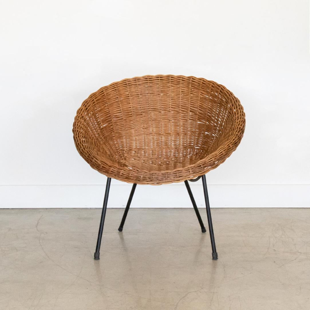 Great Italian wicker bucket chairs from the 1960's. Black iron frame and legs. Some areas of wicker have been repaired. Original finish in nice vintage condition. Single chair available. 