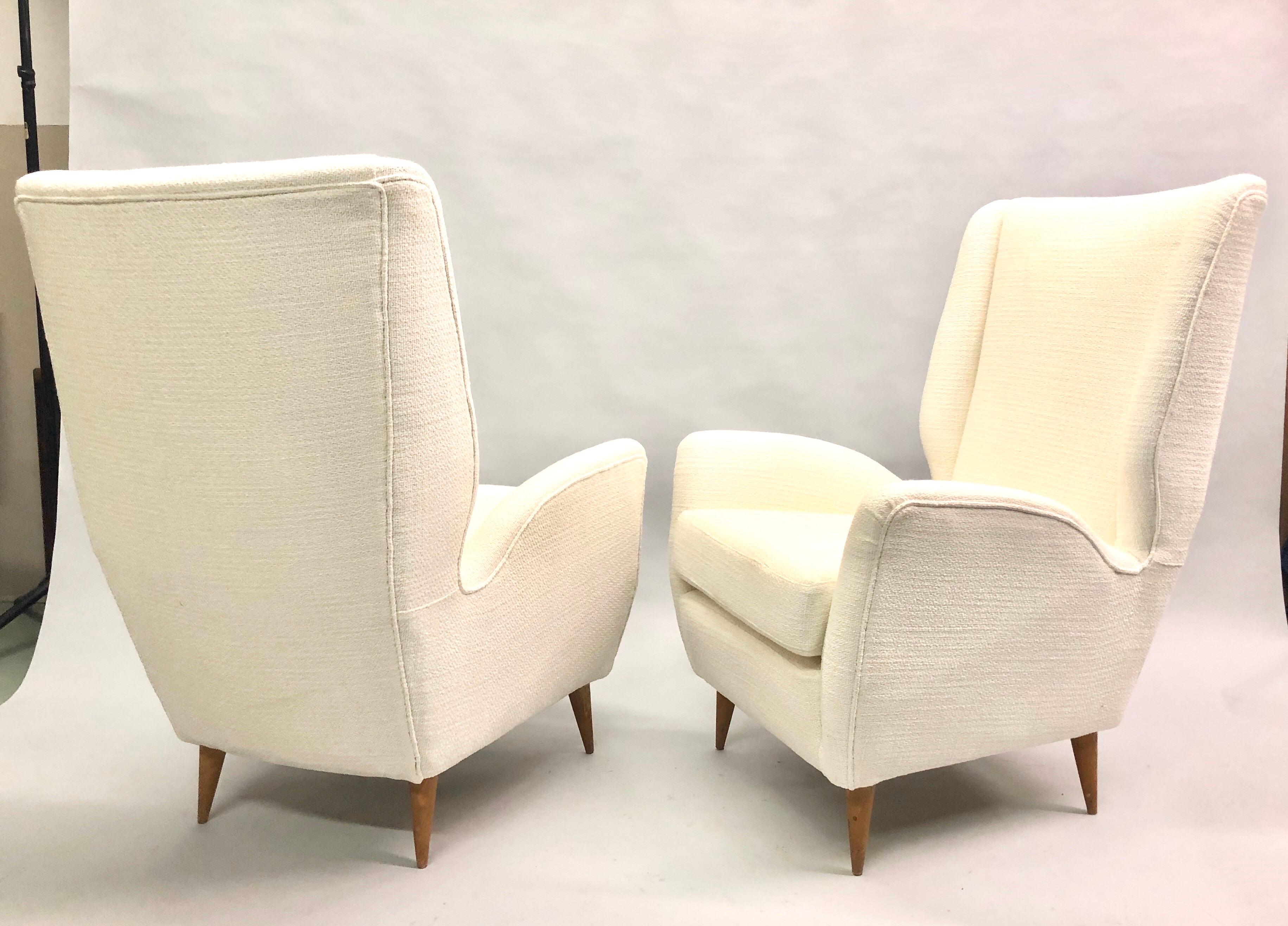 Elegant pair of Italian Mid-Century Modern hi-back lounge chairs / armchairs, model #512 by Gio Ponti. Recently re-upholstered in Italy of Italian cotton.

Documentation: See Gio Ponti by Ugo La Pietra, Rizzoli, New York. 

References: Hotel