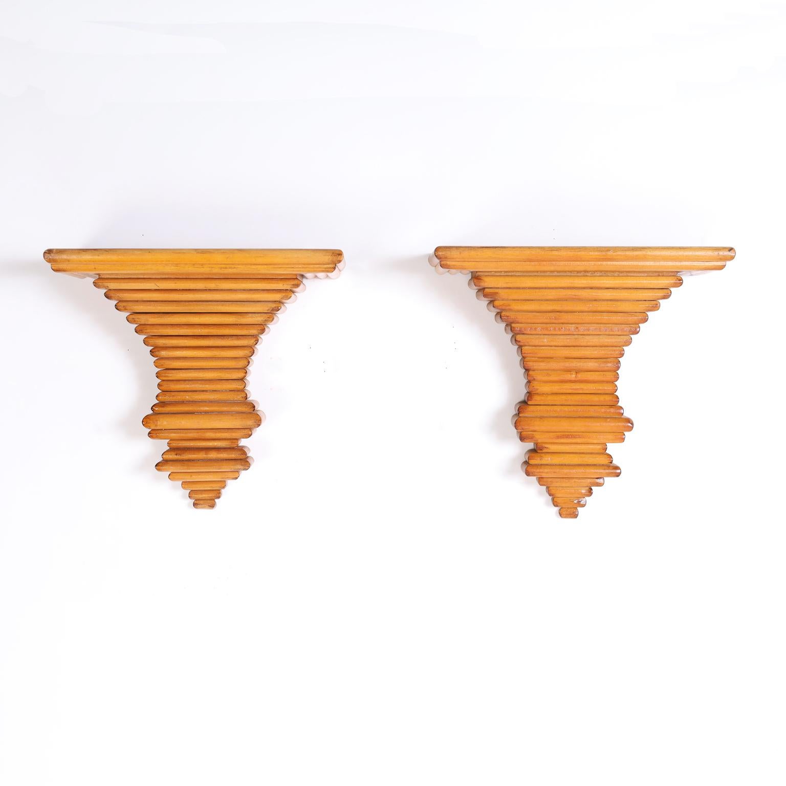 Italian wall brackets crafted in hardwood layered in an architecturally interesting form. Signed Made in Italy on the back.