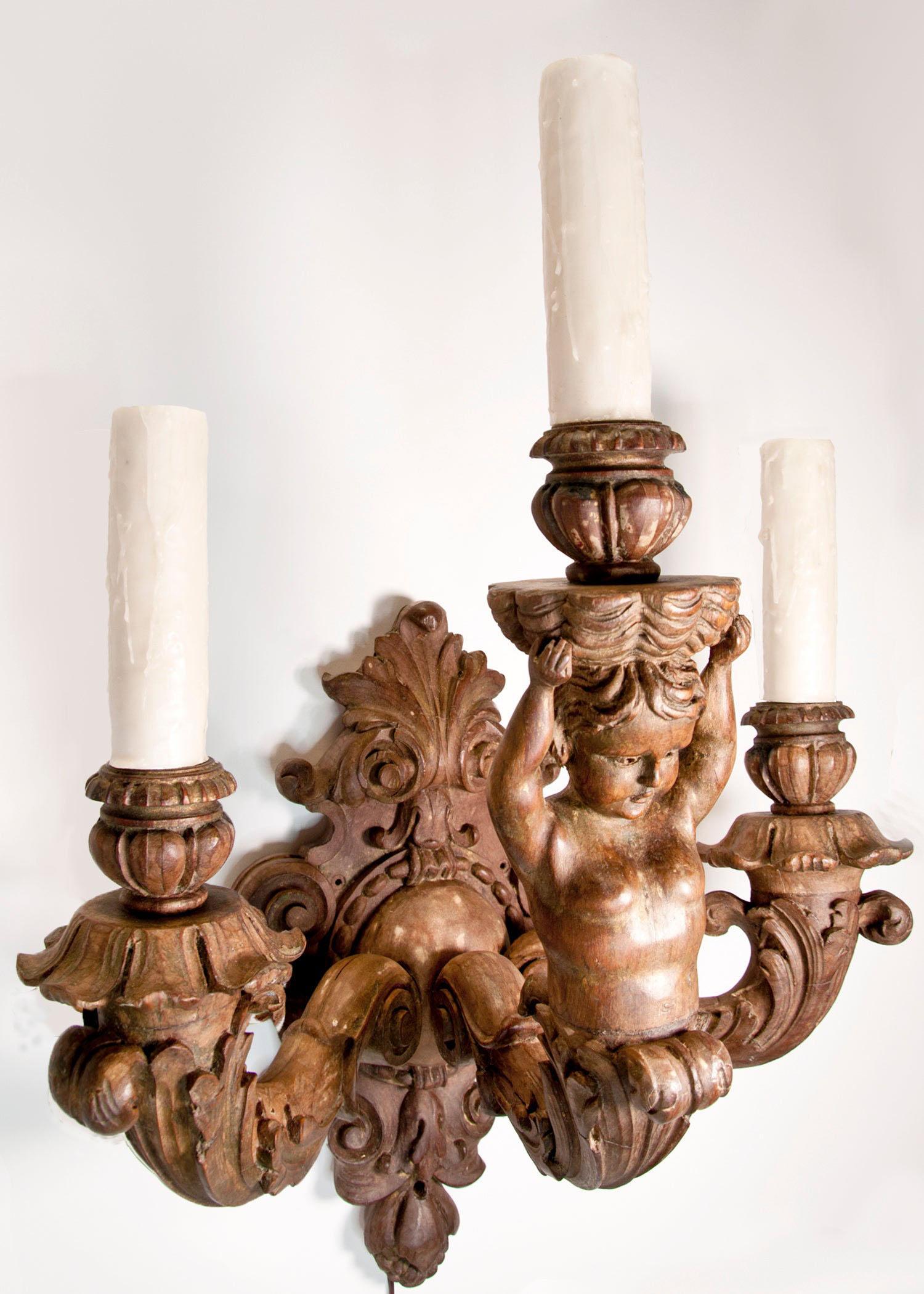 Carved Pair of Italian Wood Cherub Sconces For Sale