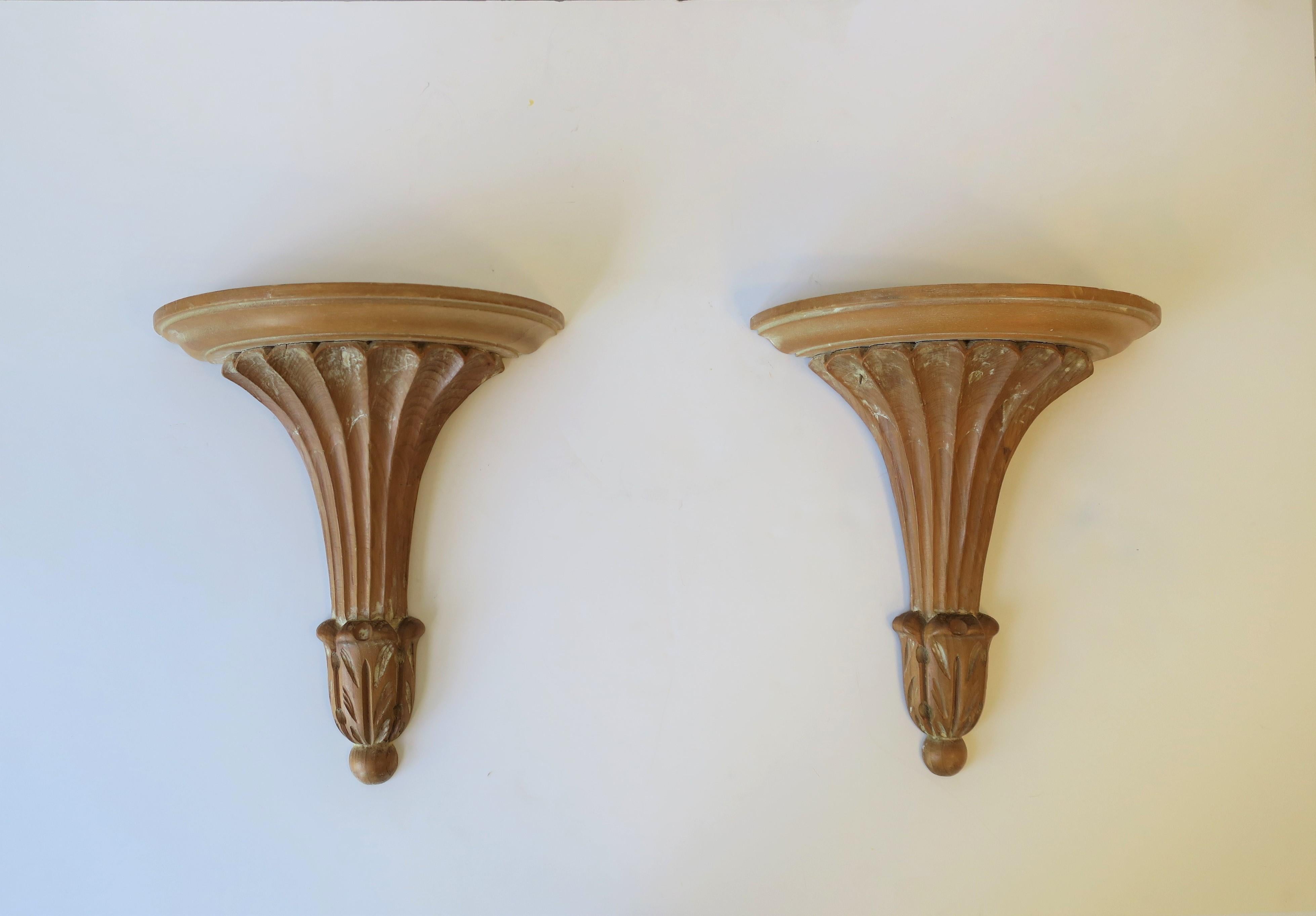 A beautiful pair of Italian natural wood wall shelves or brackets with a pillar column design in the Neoclassical style, circa mid-late 20th century, Italy. Pair are marked on back as show in images #9, 10 and 11. 

Wall brackets/shelves measure: 5