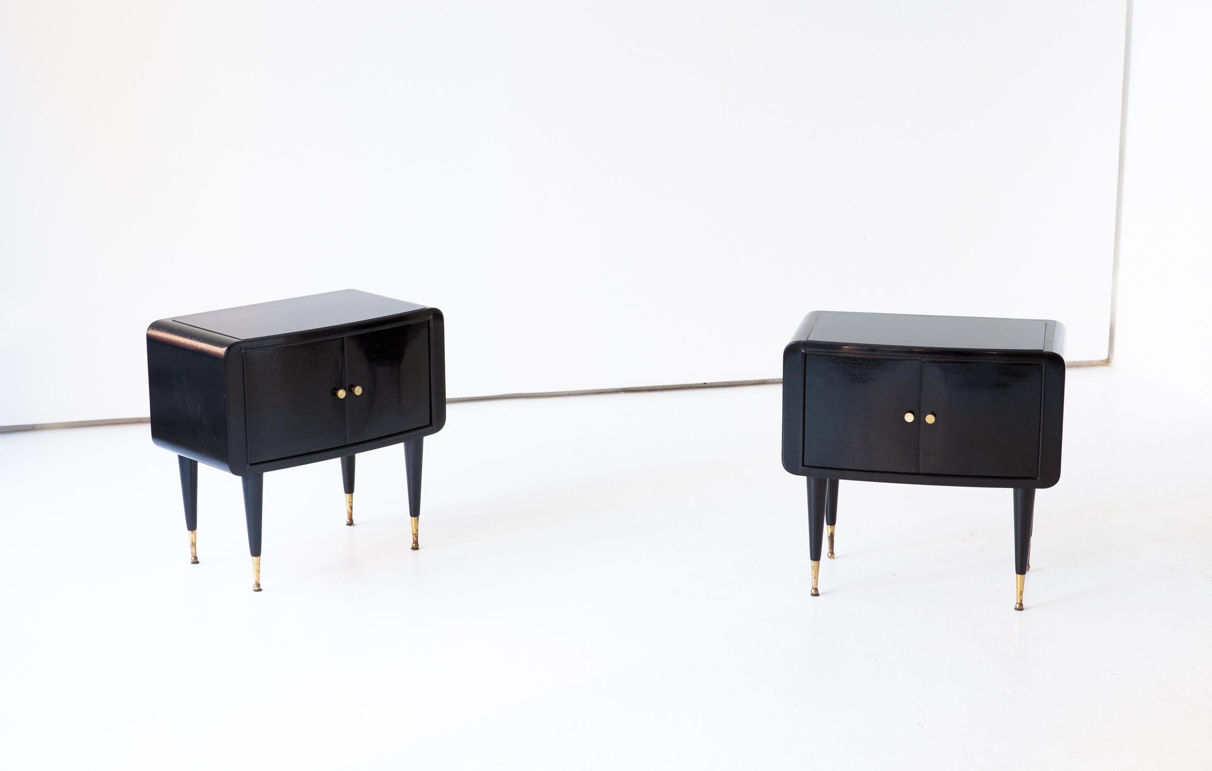 Set of two nightstands, manufactured in Italy in 1950s
These two side tables has made of black polished wood, black retrolacquered glass top and brass and handles feets
Airy and modern design,
These are a Mid-Century Modern