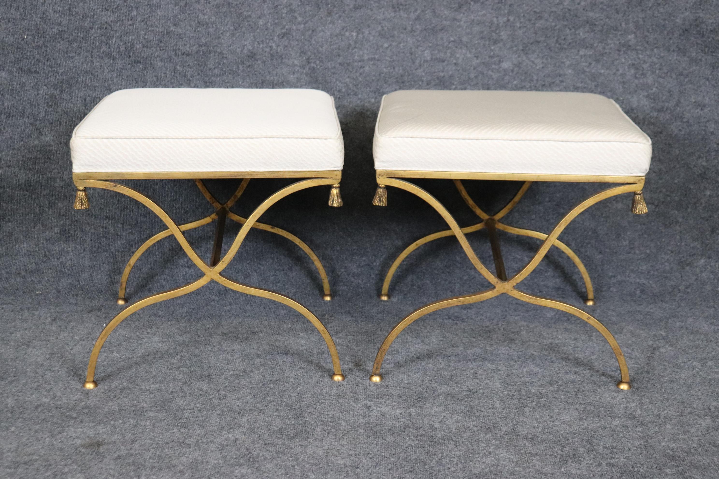 This is a gorgeous pair of benches from the 1950-60s era in the Hollywod Regency style. The benches are in good vintage condition and may show minor wear or minor subtle stains to upholstery not visible in photos. Measures 18 x 18 x 18.25 tall and