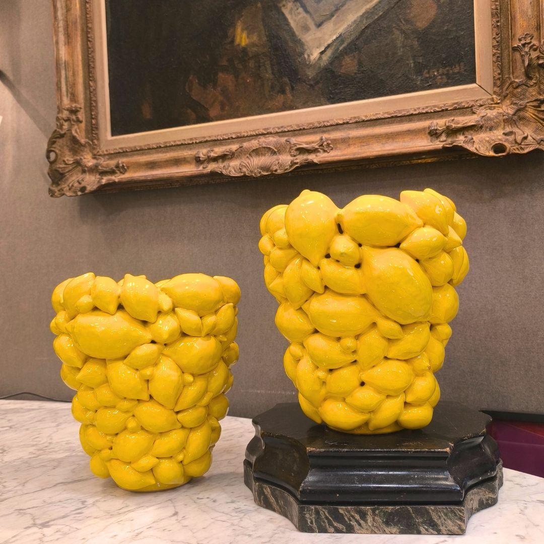 Gorgeous and Original pair of enameled ceramic vases filled with lemons in high relief, original from southern Italy. This contemporary design belongs to a limited edition by Rosalinda Acampora, an Italian painter who lives and works in Sorrento, a