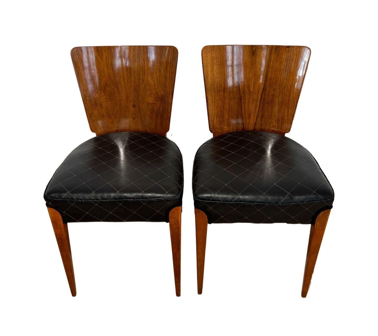Pair of Art Deco chairs H-214 by J. Halabala from Czech Republic around 1930
* Design: Jindrich Halabala (1903 - 1978)
* Manufacturer: UP Zavody
* Walnut veneer on backboard
* Solid beech legs
* Newly uphstered, very comfortable
* Uphstered in black
