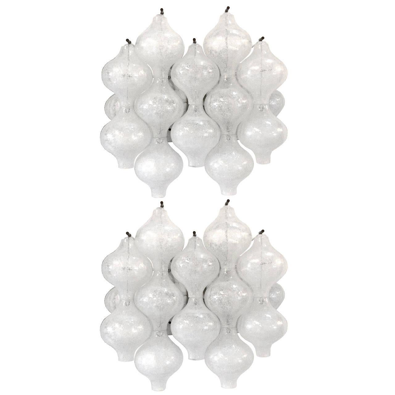 A pair of tulipan glass sconces with metal frames and brass hardware by J. T. Kalmar.

Austrian, Circa 1960's