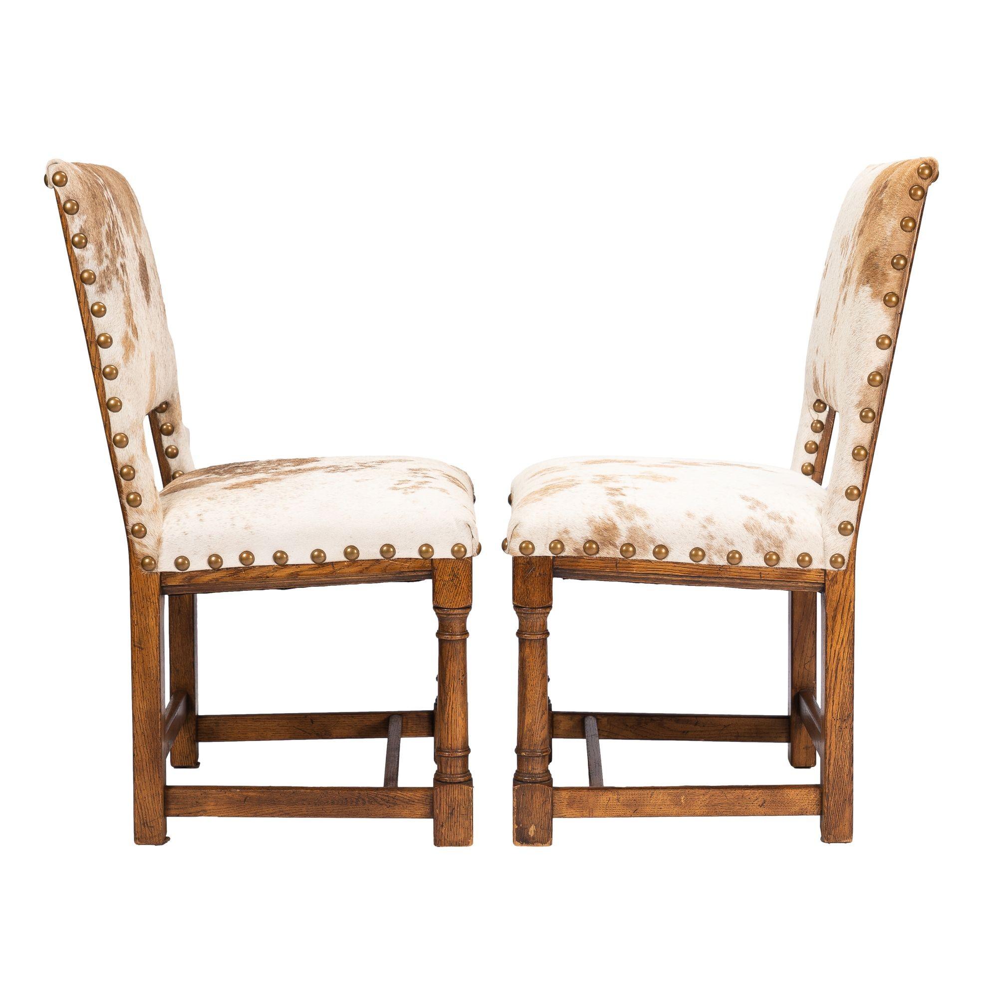American Pair of Jacobean style hair on hide oak side chairs, 1920-35 For Sale