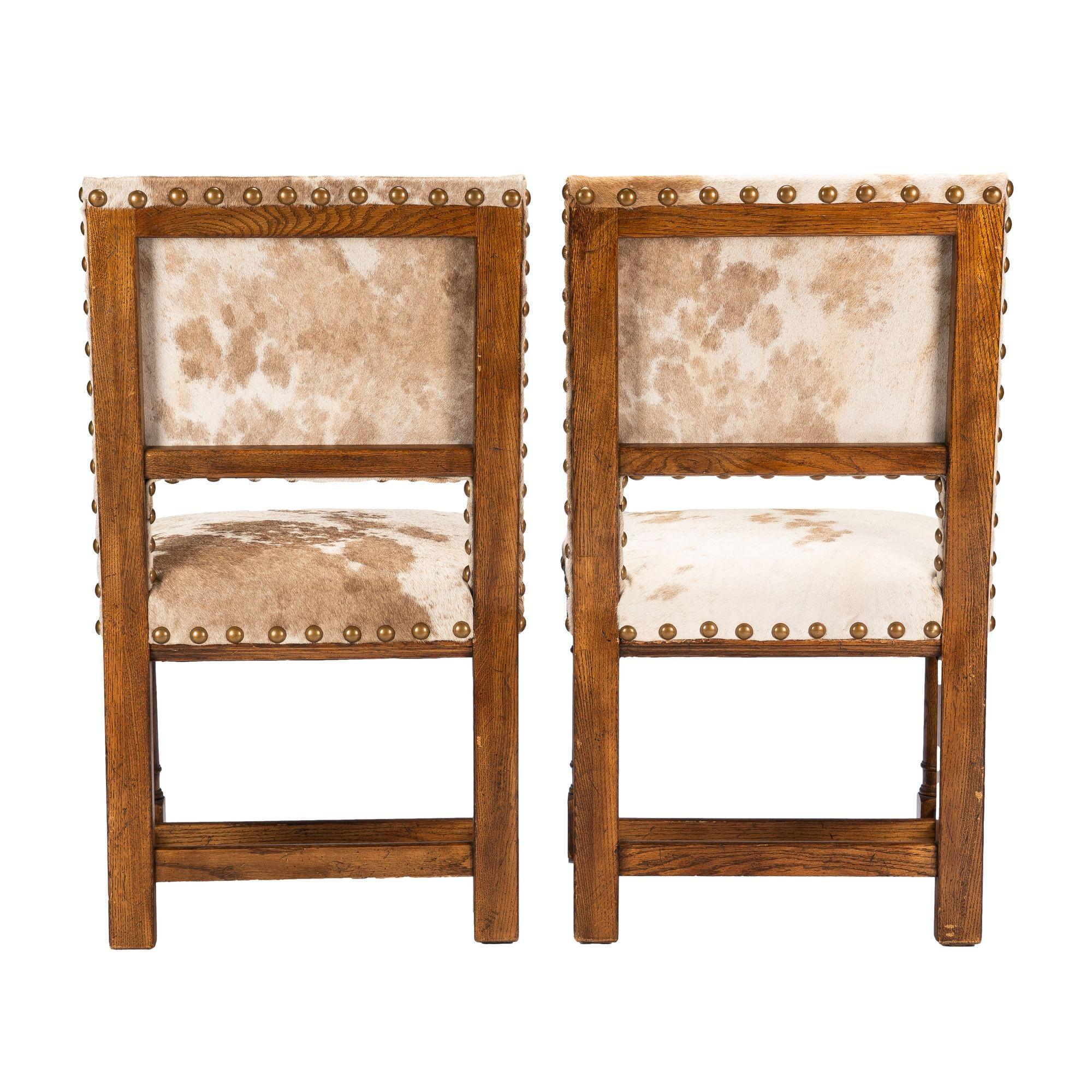 20th Century Pair of Jacobean style hair on hide oak side chairs, 1920-35 For Sale