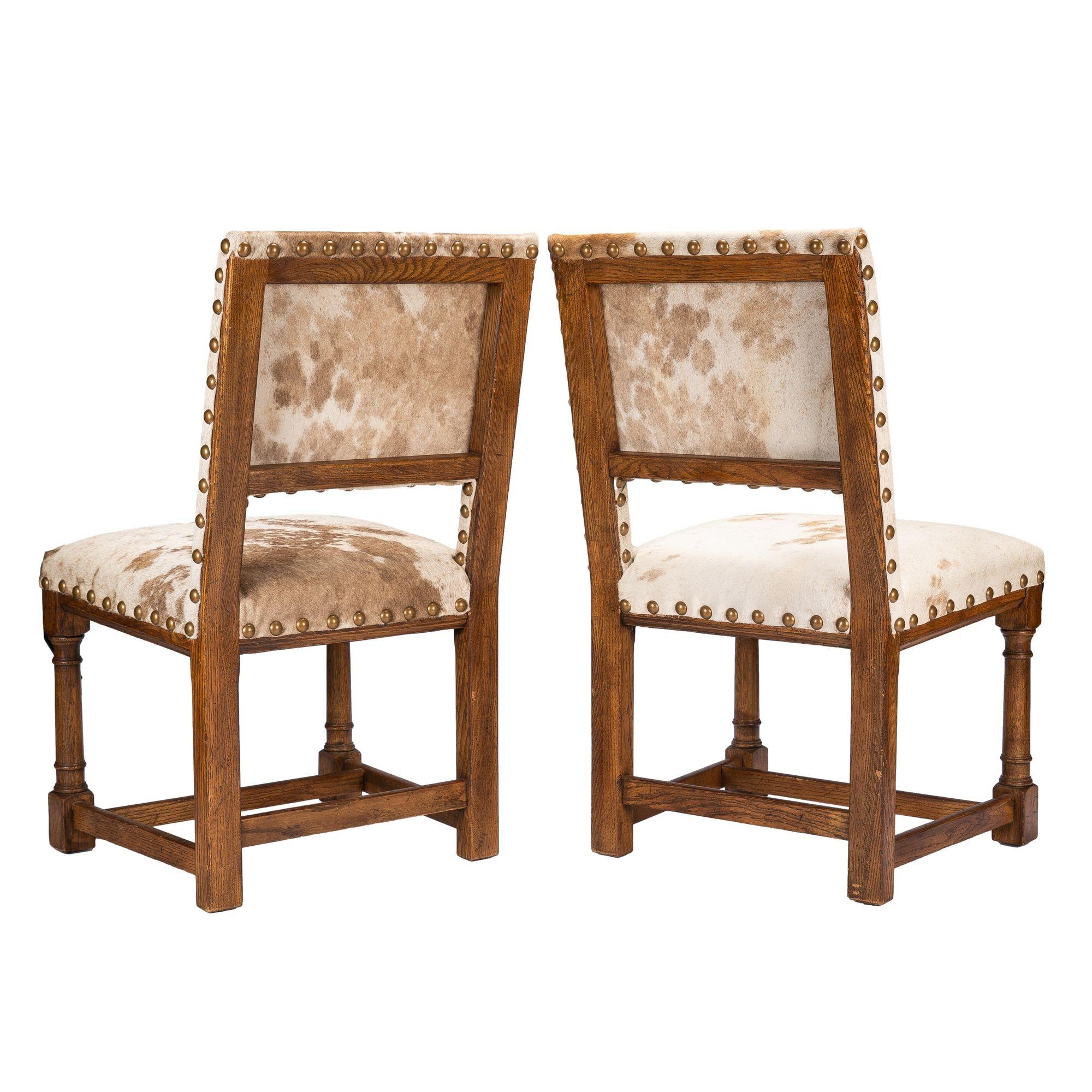 Hide Pair of Jacobean style hair on hide oak side chairs, 1920-35 For Sale