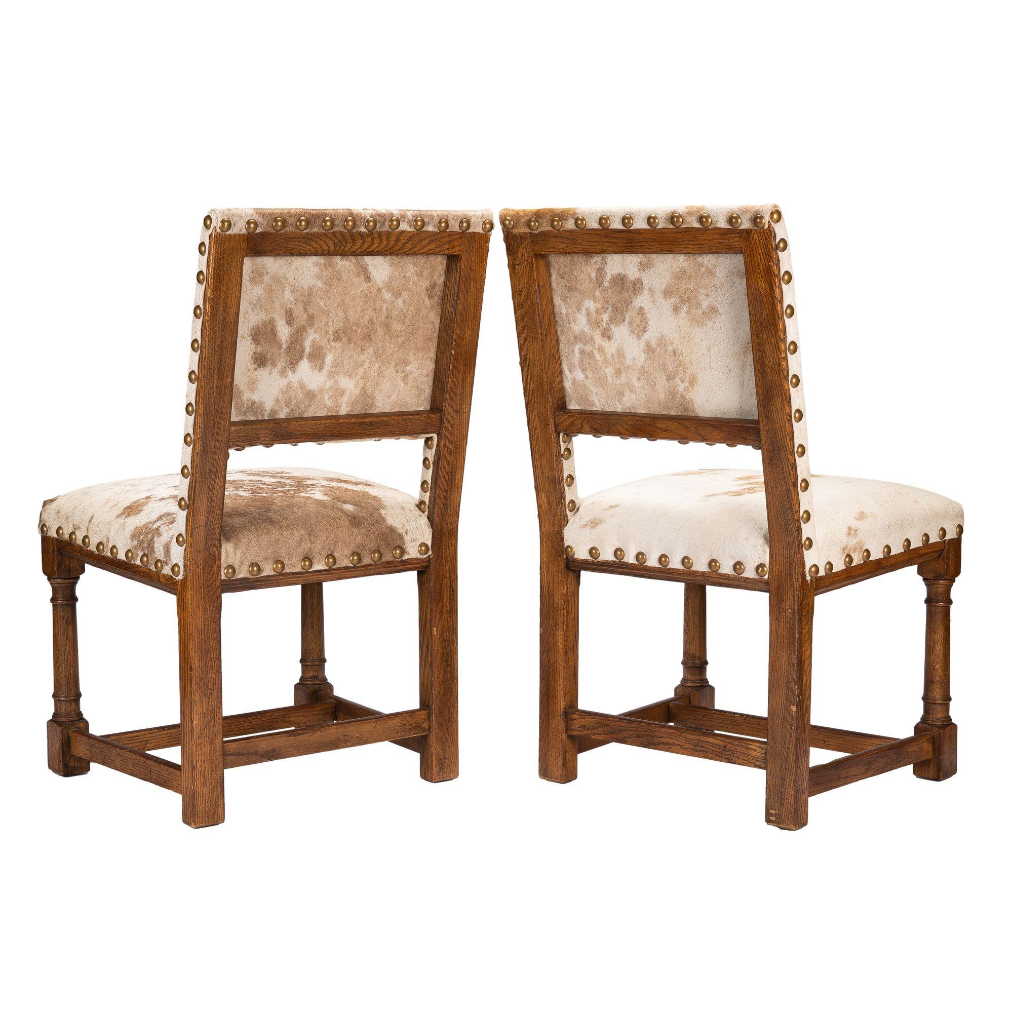 Pair of Jacobean style hair on hide oak side chairs, 1920-35 For Sale 1