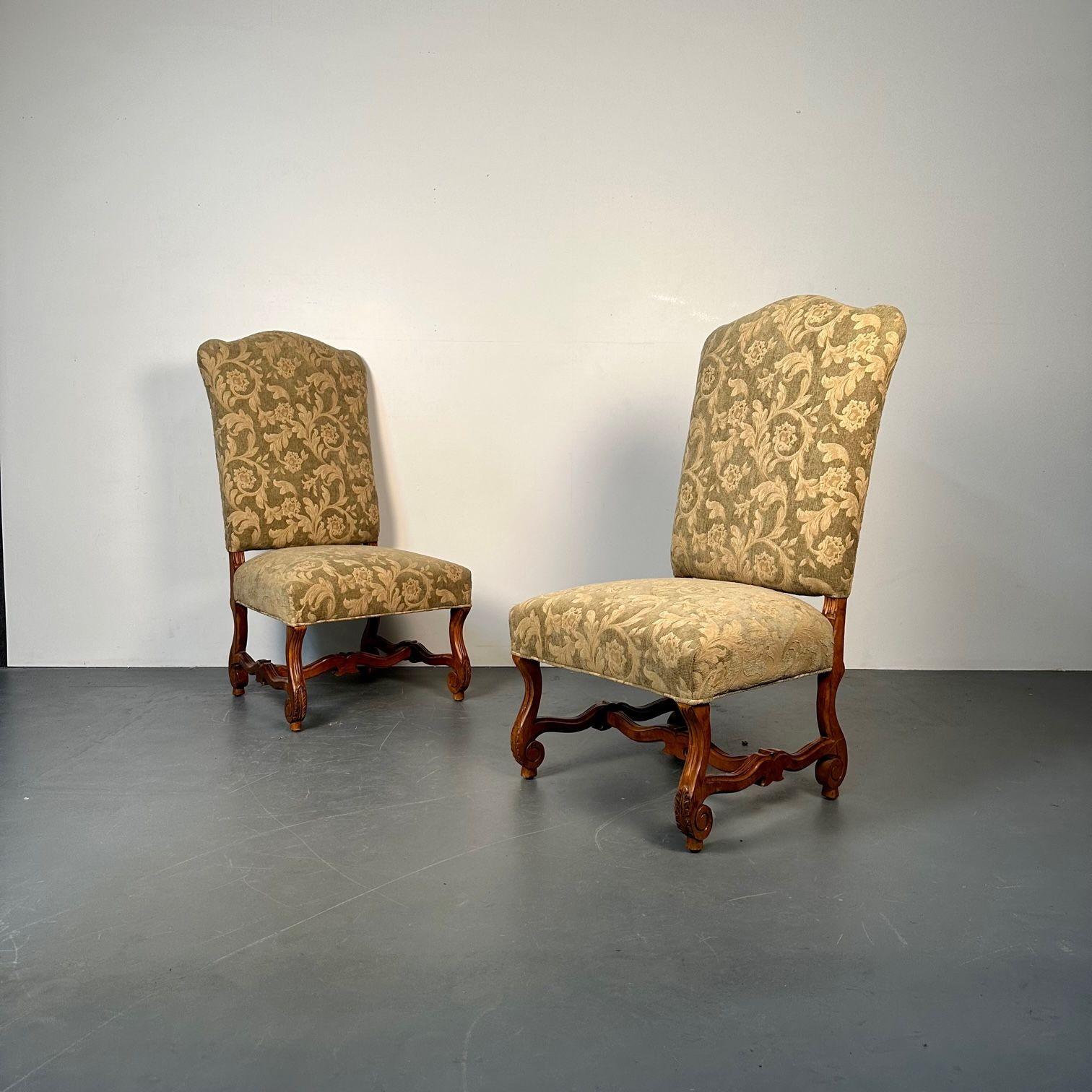 Pair of Jacobean Throne Chairs, King and Queen, Fine Fabric
 
A fine pair of wonderfully upholstered Throne chairs in the Jacobean fashion.  Fauteuils each with an arched back and padded seat joined to open sides and raised on turned legs joined by