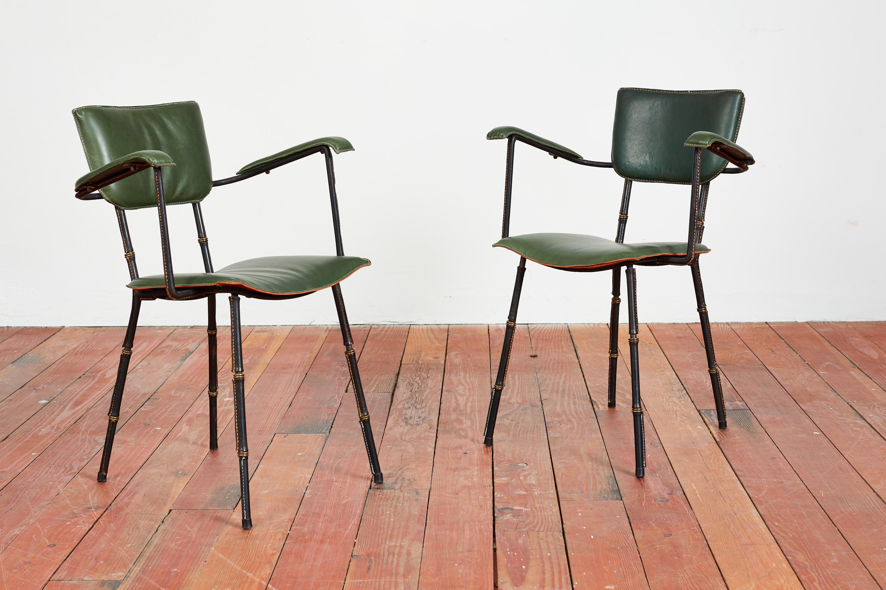 Rare Pair of Jacques Adnet Armchairs with fantstic original green leather and signature contrast stitching. 

Leather bamboo legs with brass accents. 

France 1940's.