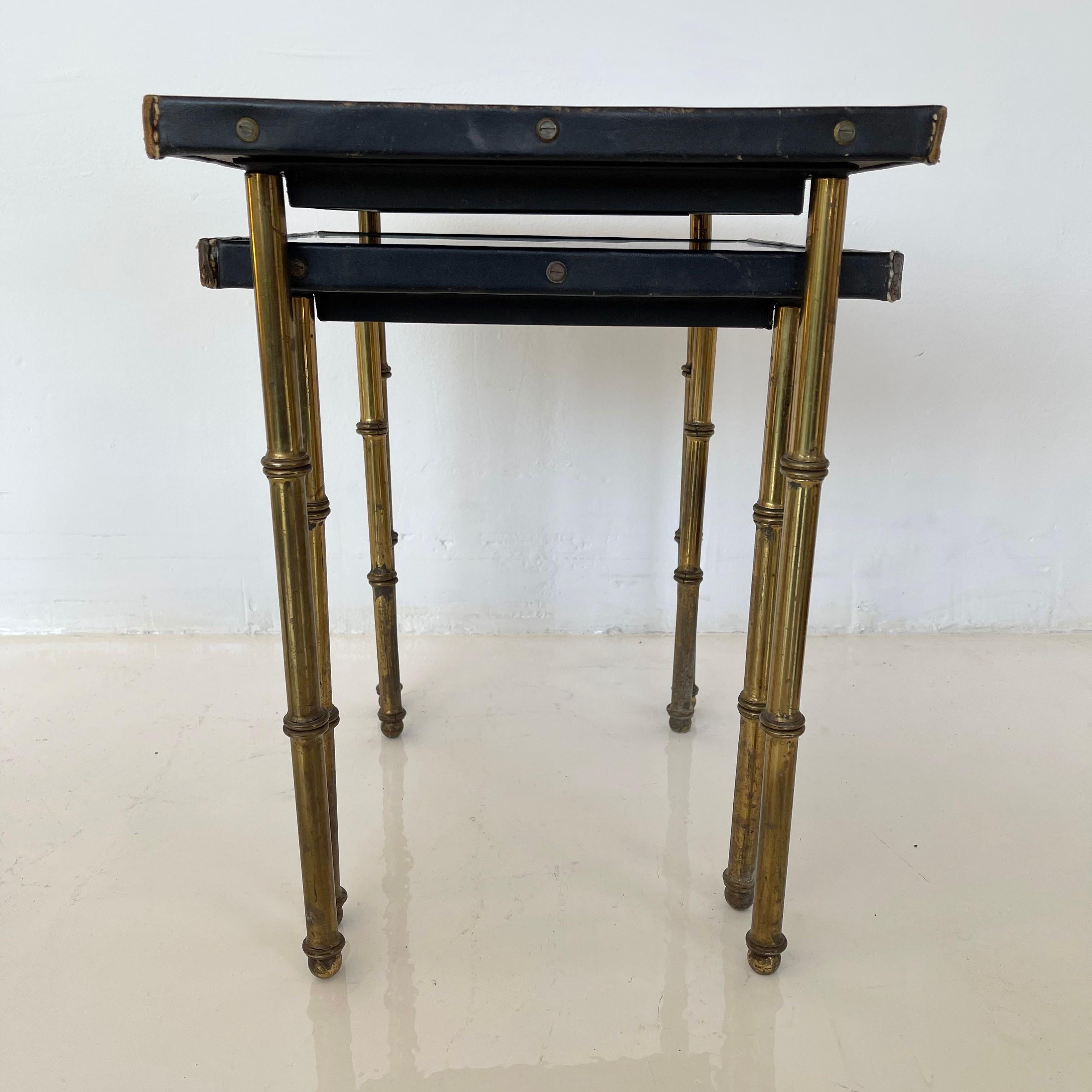Pair of Jacques Adnet Leather and Brass Nesting Tables, 1950s France In Good Condition In Los Angeles, CA