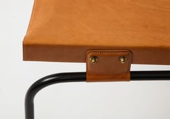 Coppia di sedie da pranzo in pelle Jacques Adnet