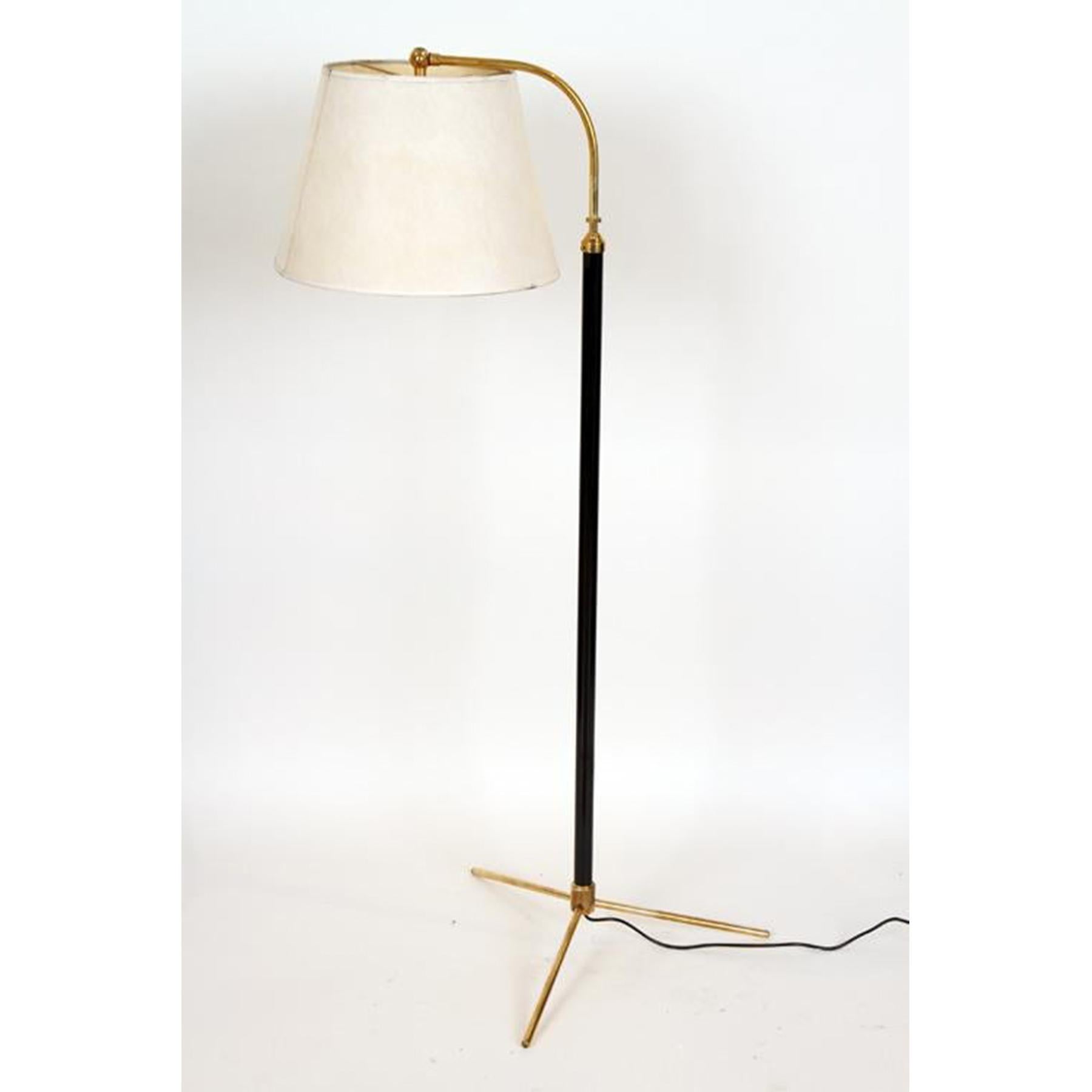 A beautiful pair of Jacques Adnet styled floor lamps with a sleek polished brass tripod base and neck.