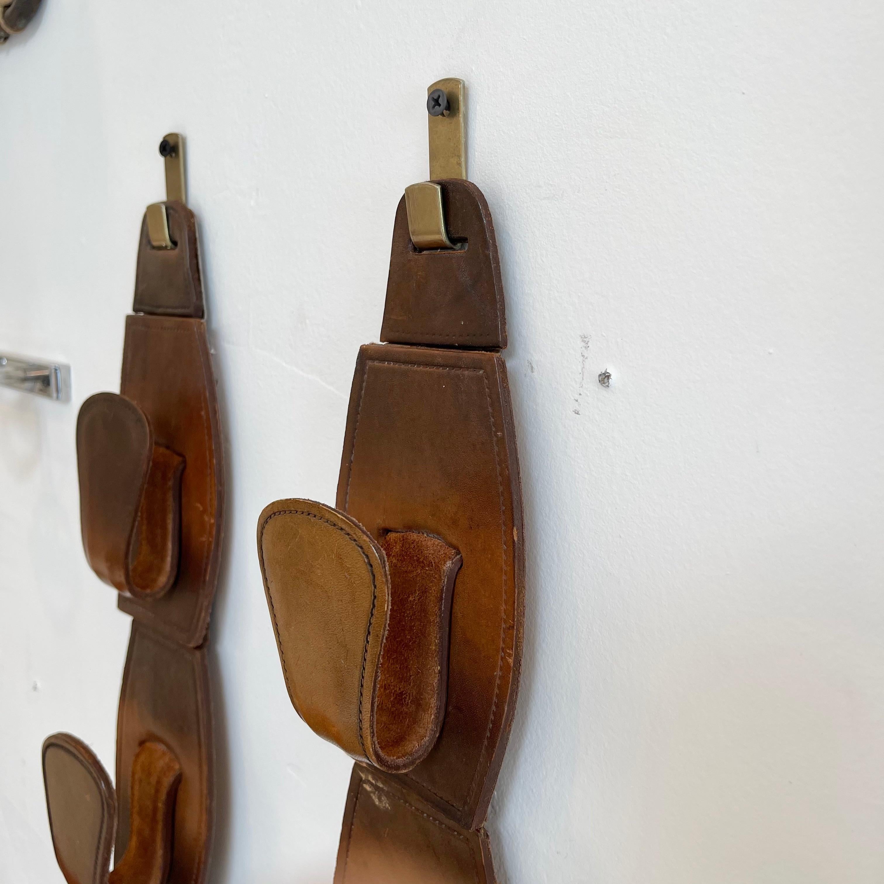 Pair of Jacques Adnet Style Saddle Leather Wall Hooks In Good Condition For Sale In Los Angeles, CA